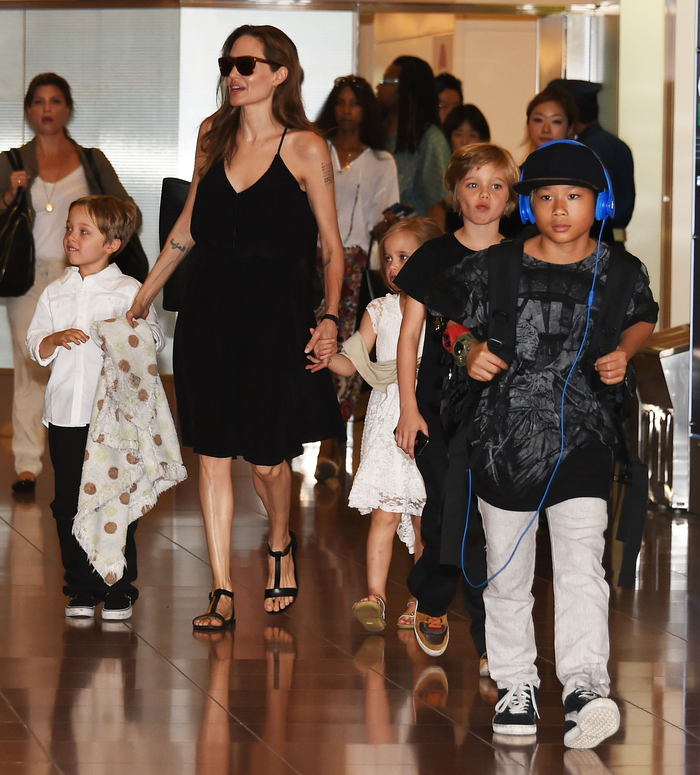 Pax Jolie-Pitt and his family photographed at Haneda Airport on June 21, 2014, in Tokyo, Japan. | Source: Getty Images