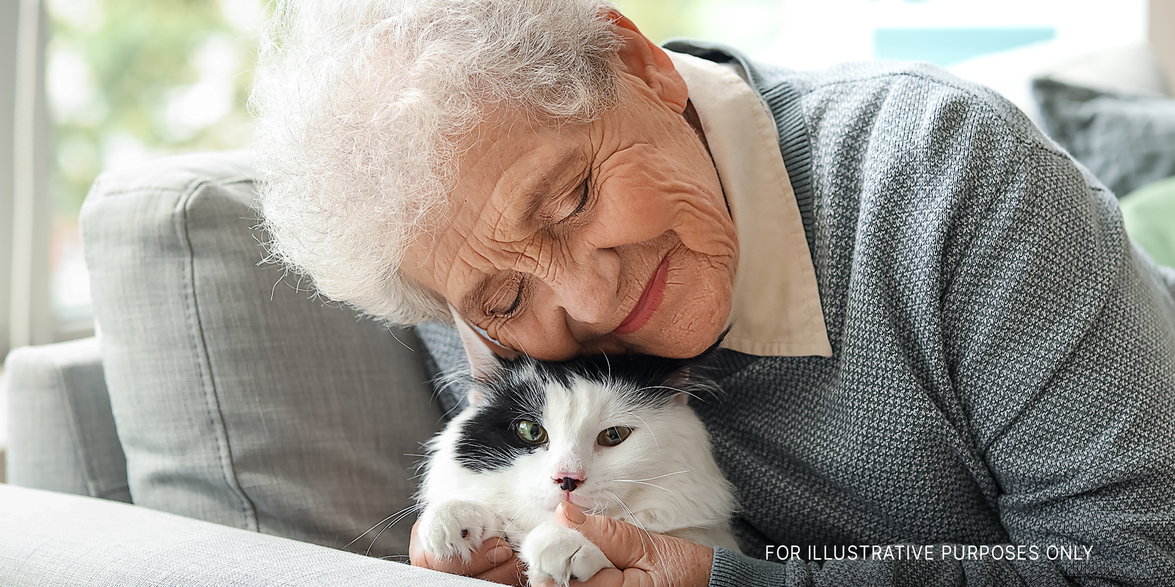 A senior woman with her adorable cat | Source: Shutterstock