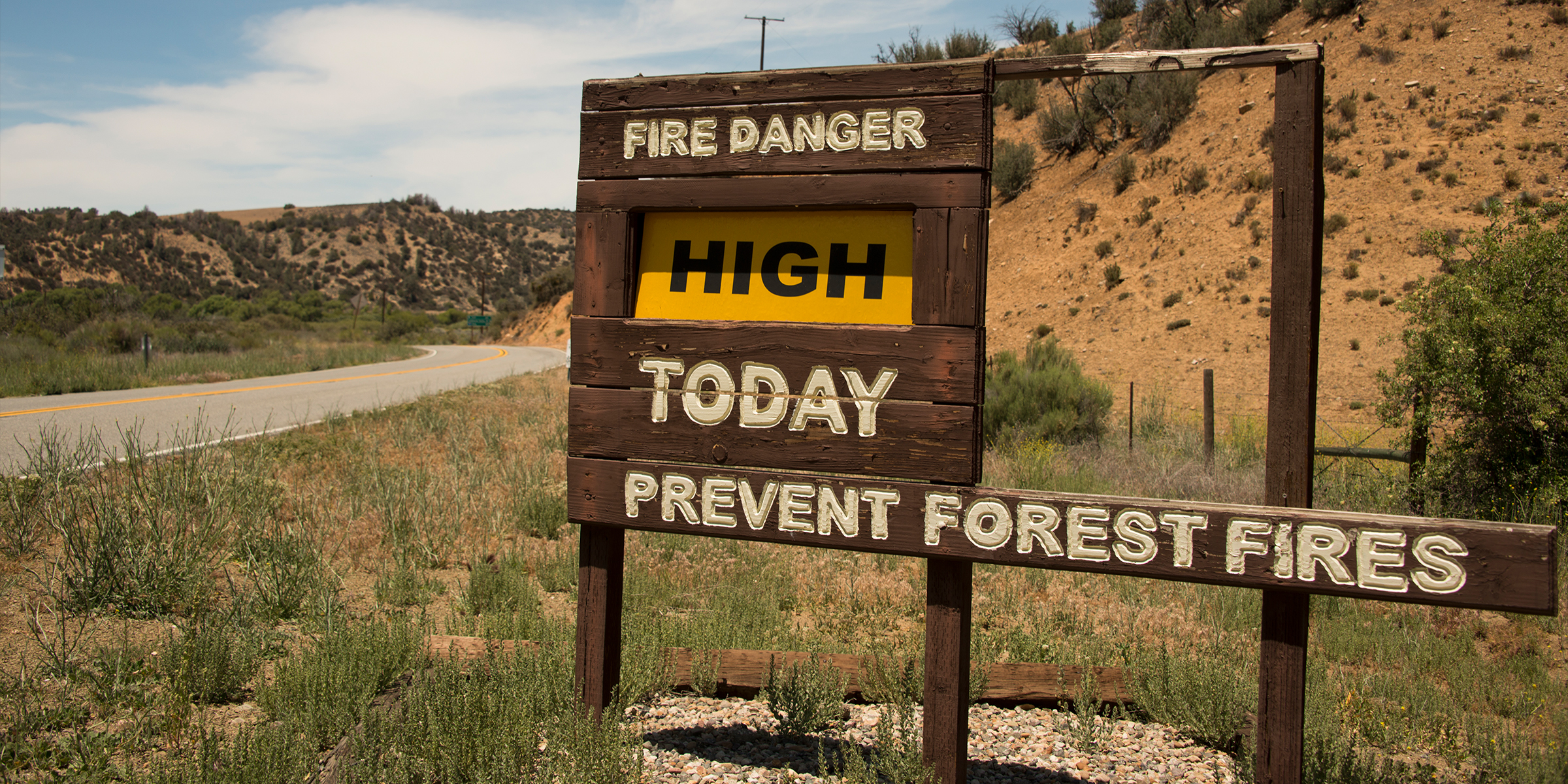 Fire warning sign at roadside in the Cuyama Valley, California | Source: Getty Images