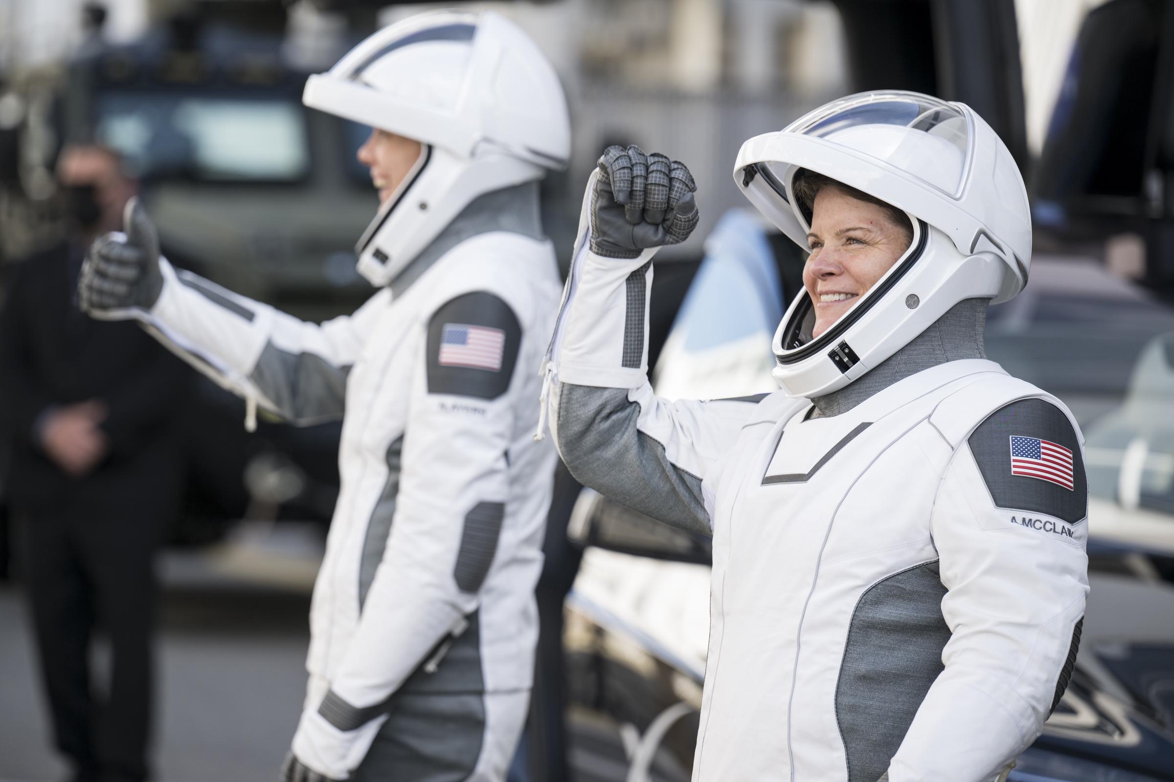 NASA astronauts Anne McClain and Nichole Ayers gesture to friends and family before boarding the SpaceX Dragon spacecraft for the Crew-10 mission launch on March 14, 2025 | Source: Getty Images