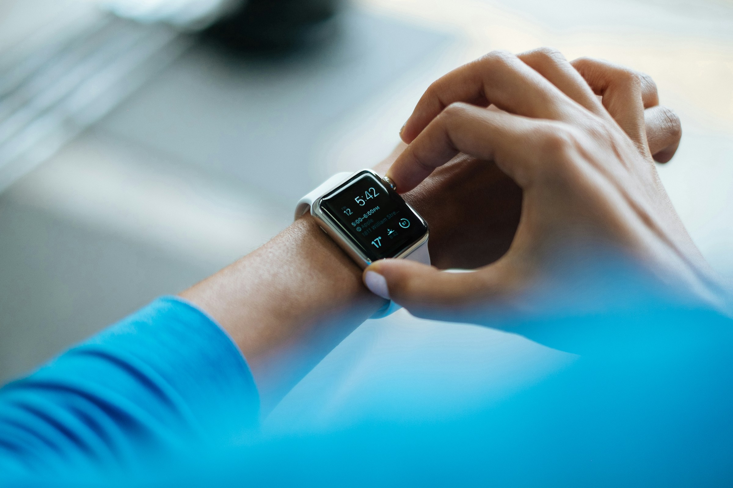 A person holding their smartwatch | Source: Unsplash