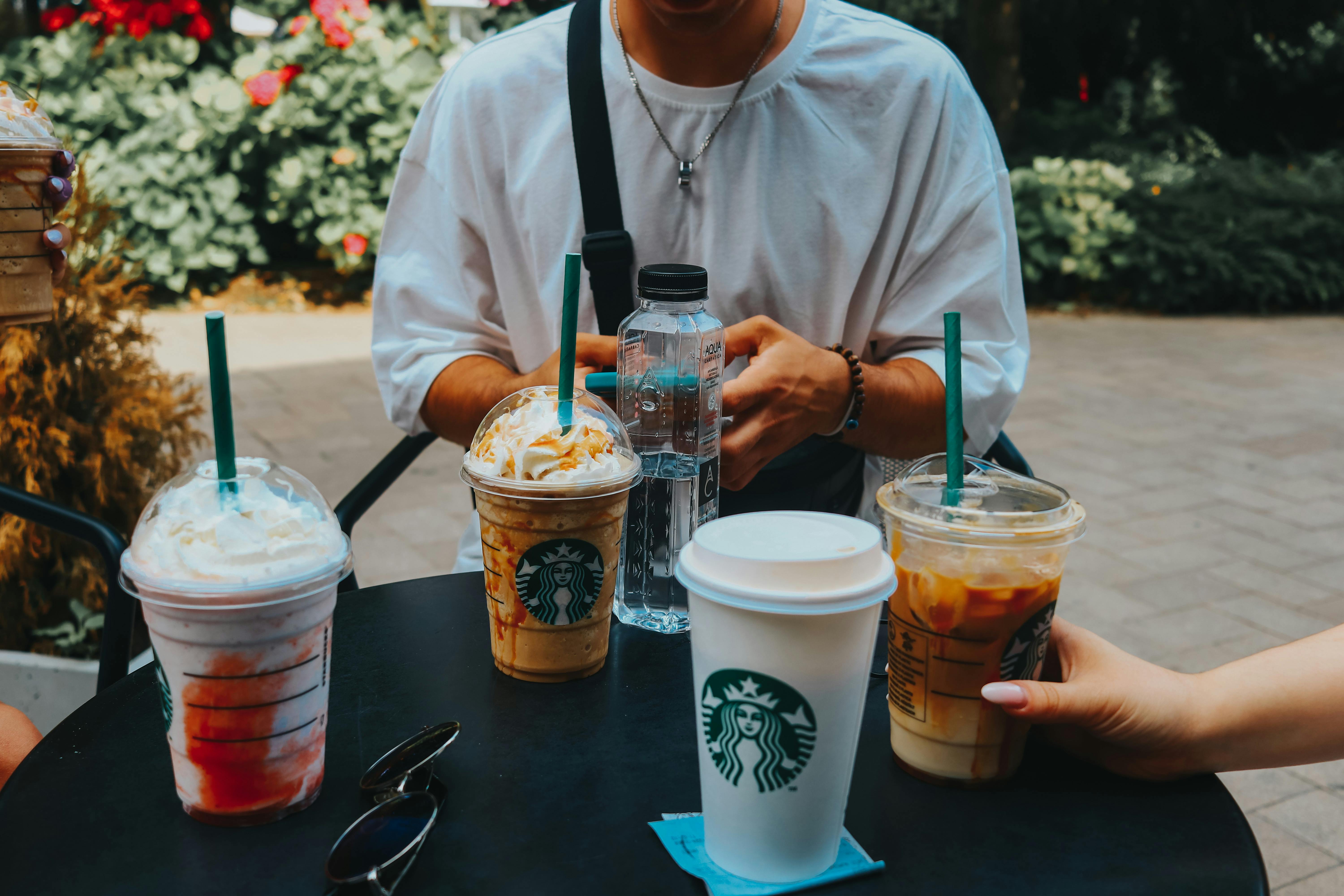 A table filled with Starbucks beverages | Source: Pexels