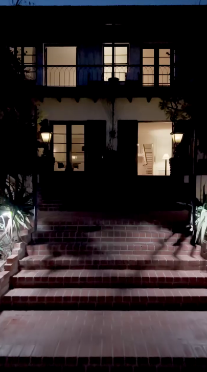 Here's a look at one of the entrances of the house at night. It's more homey than most luxury mansions. | Source: Instagram/weahomes
