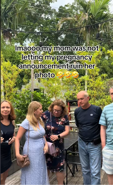 Olena Perez stands beside her mom as the mom is distracted with her bag, posted in June 2025 | Source: TikTok/olena.perez