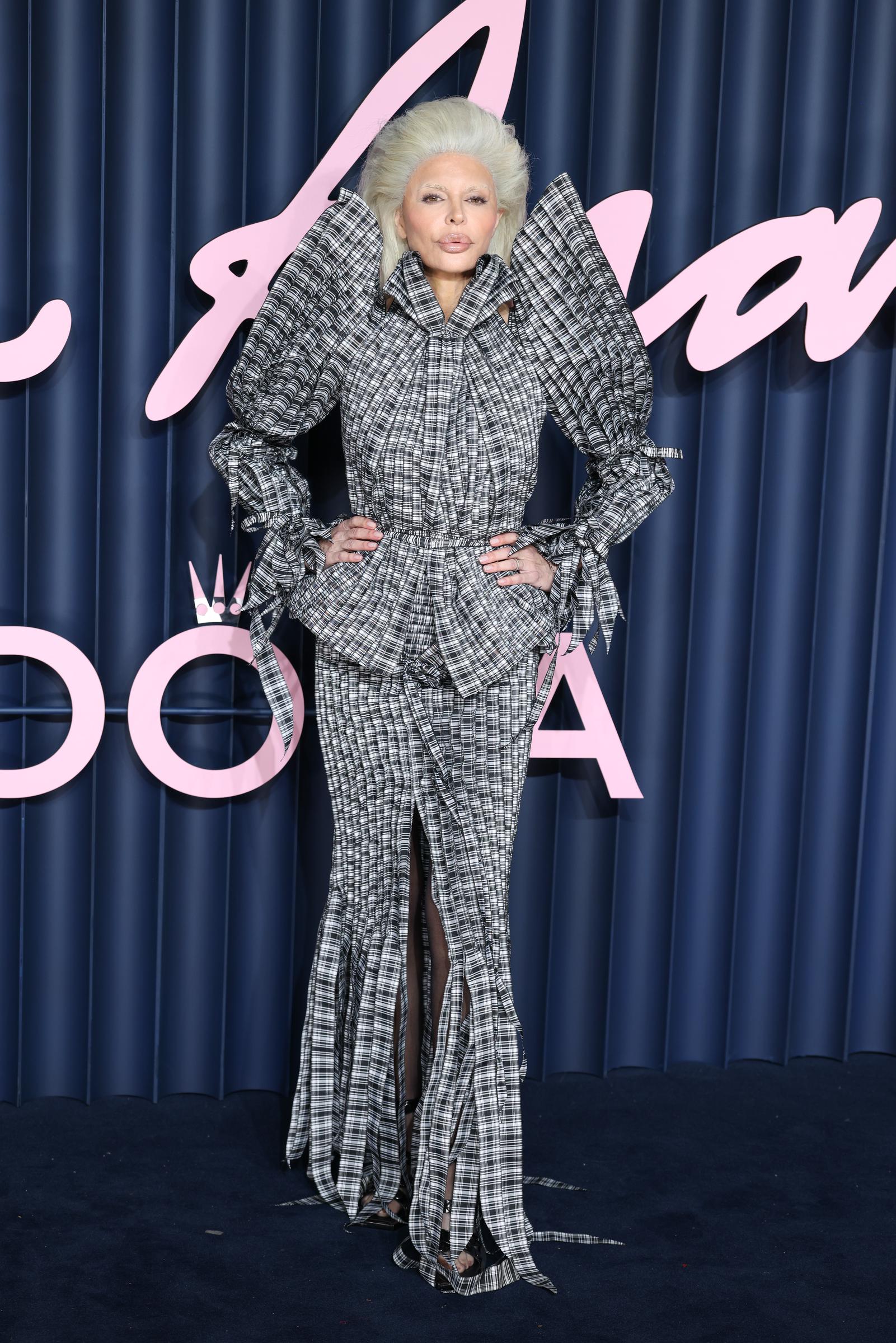 Lisa Rinna poses with her hands on her waist at the Fashion Awards 2025. | Source: Getty Images