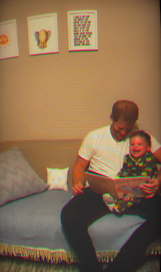 Harry reading a book and laughing with Archie. | Source: Instagram/meghan