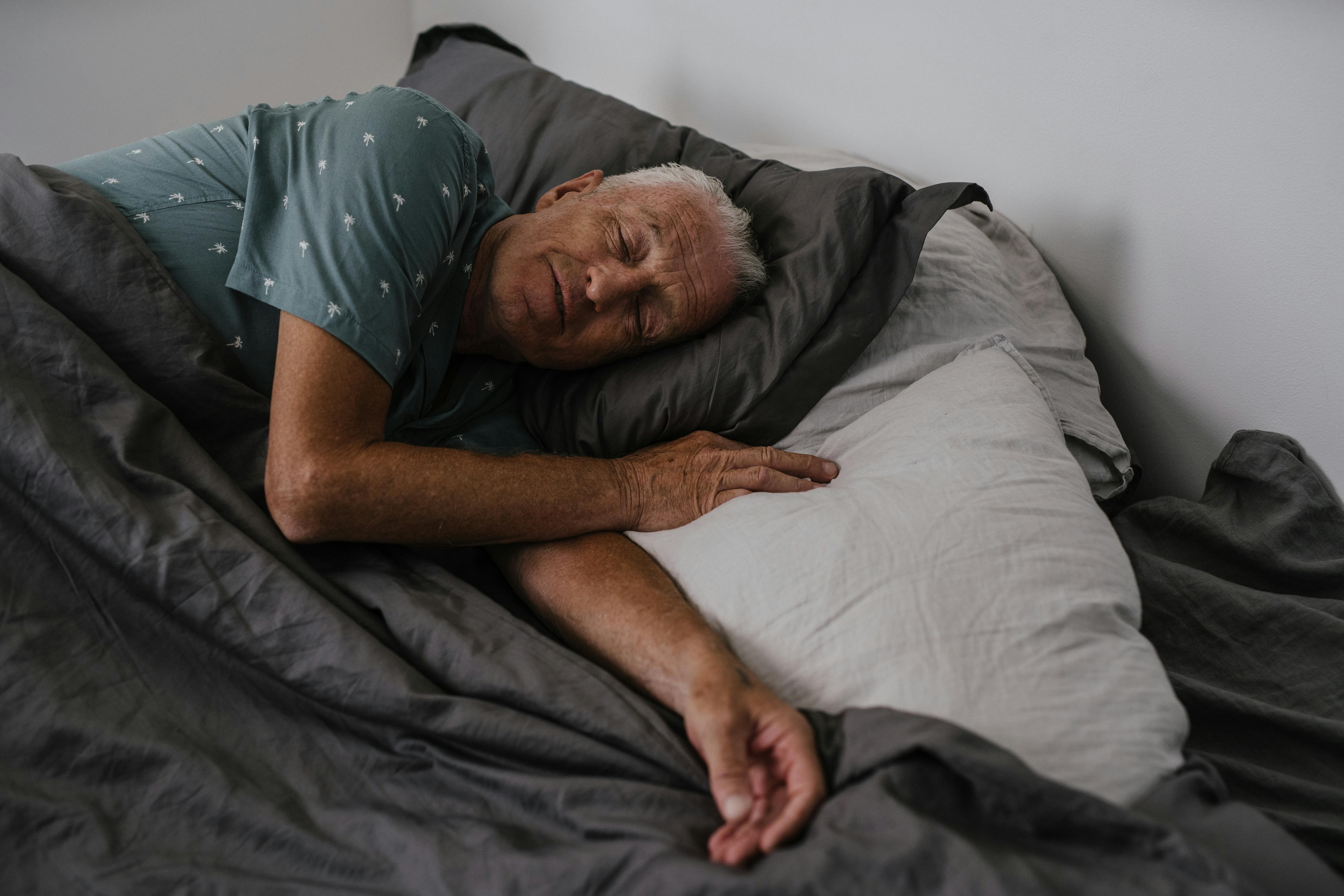 A lonely man lying in bed | Source: Pexels