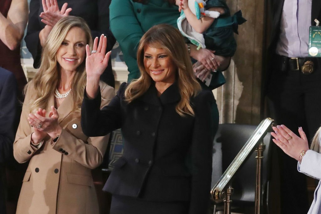 Melania Trump waves to the crowd from the First Lady's box as stood next to Lara Trump during the State of the Union address, on February 04, 2020, Washington, DC | Source: Mark Wilson/Getty Images