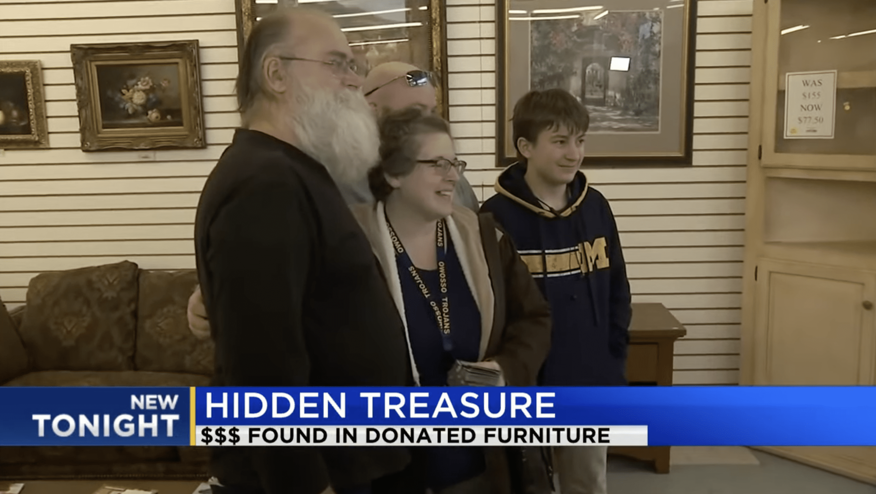 Howard Kirby pictured with the family who donated the couch. | Photo: YouTube.com/WNEM TV5