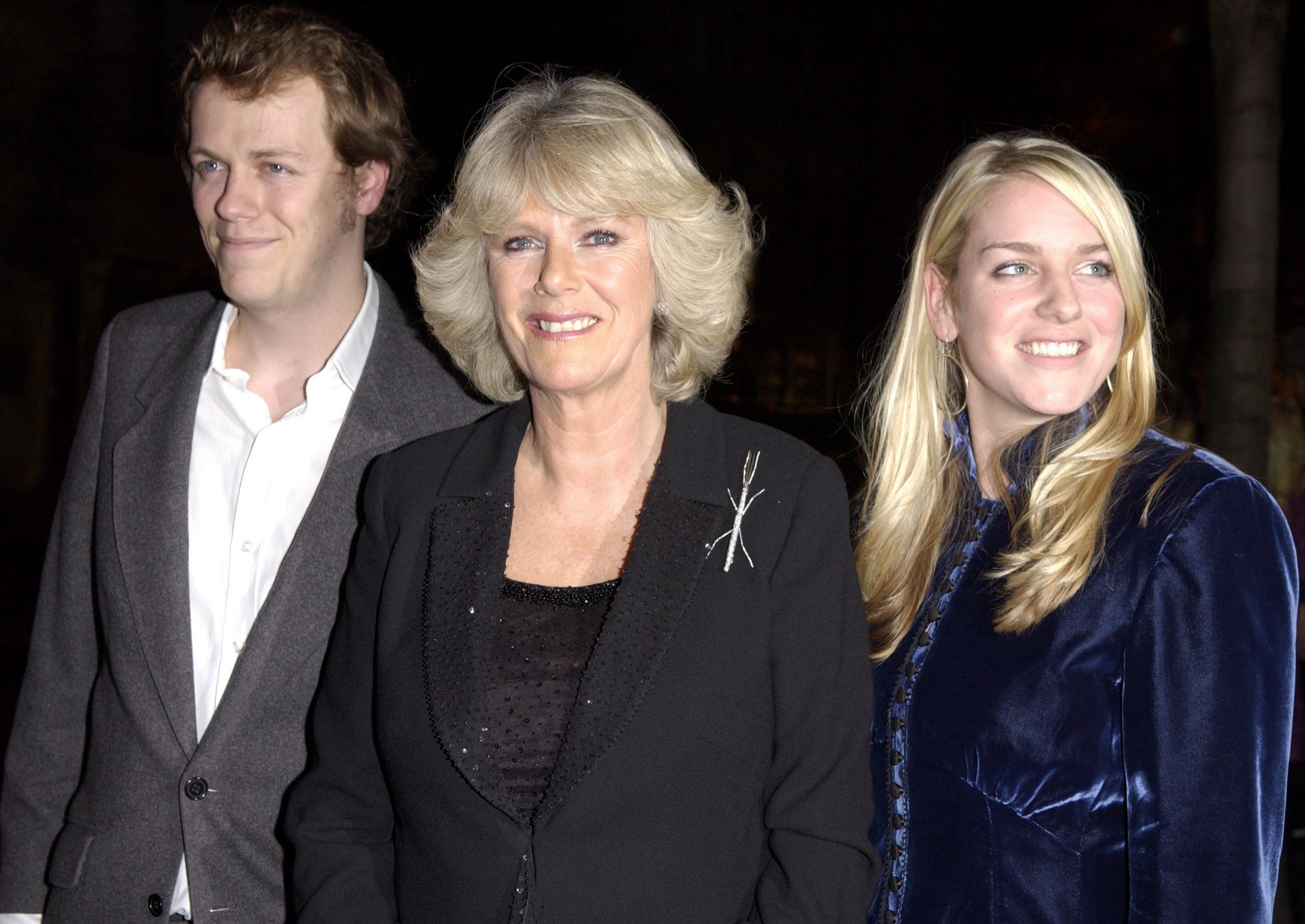 Camilla Parker Bowles with her son, Tom Parker Bowles, and daughter, Laura Parker Bowles, arriving at a party in Kensington to celebrate the release of his new book,  "E Is for Eating: An Alphabet of Greed" on November 3, 2004. | Source: Getty Images 