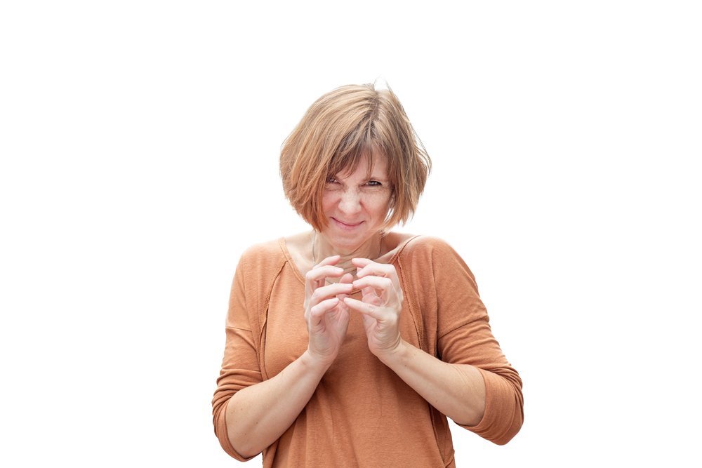 Mujer de mediana edad con gesto cruel. | Foto: Shutterstock
