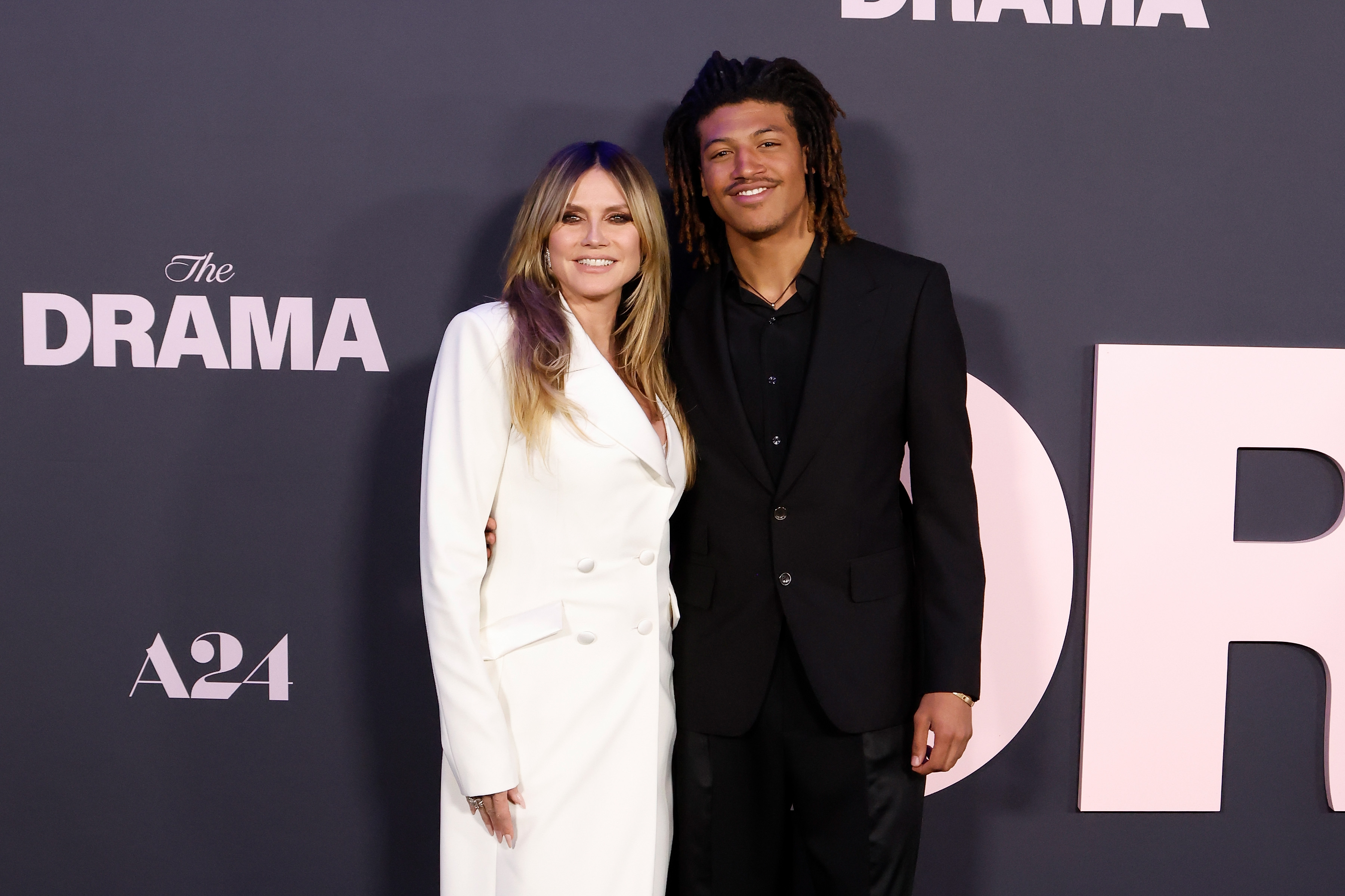 Standing side by side at the New York premiere of The Drama in New York City, Heidi Klum and Henry Samuel strike a polished contrast. They effortlessly capture red carpet elegance with a modern edge.