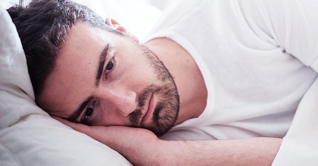 A sick man lying on an hospital bed | Photo: Shutterstock