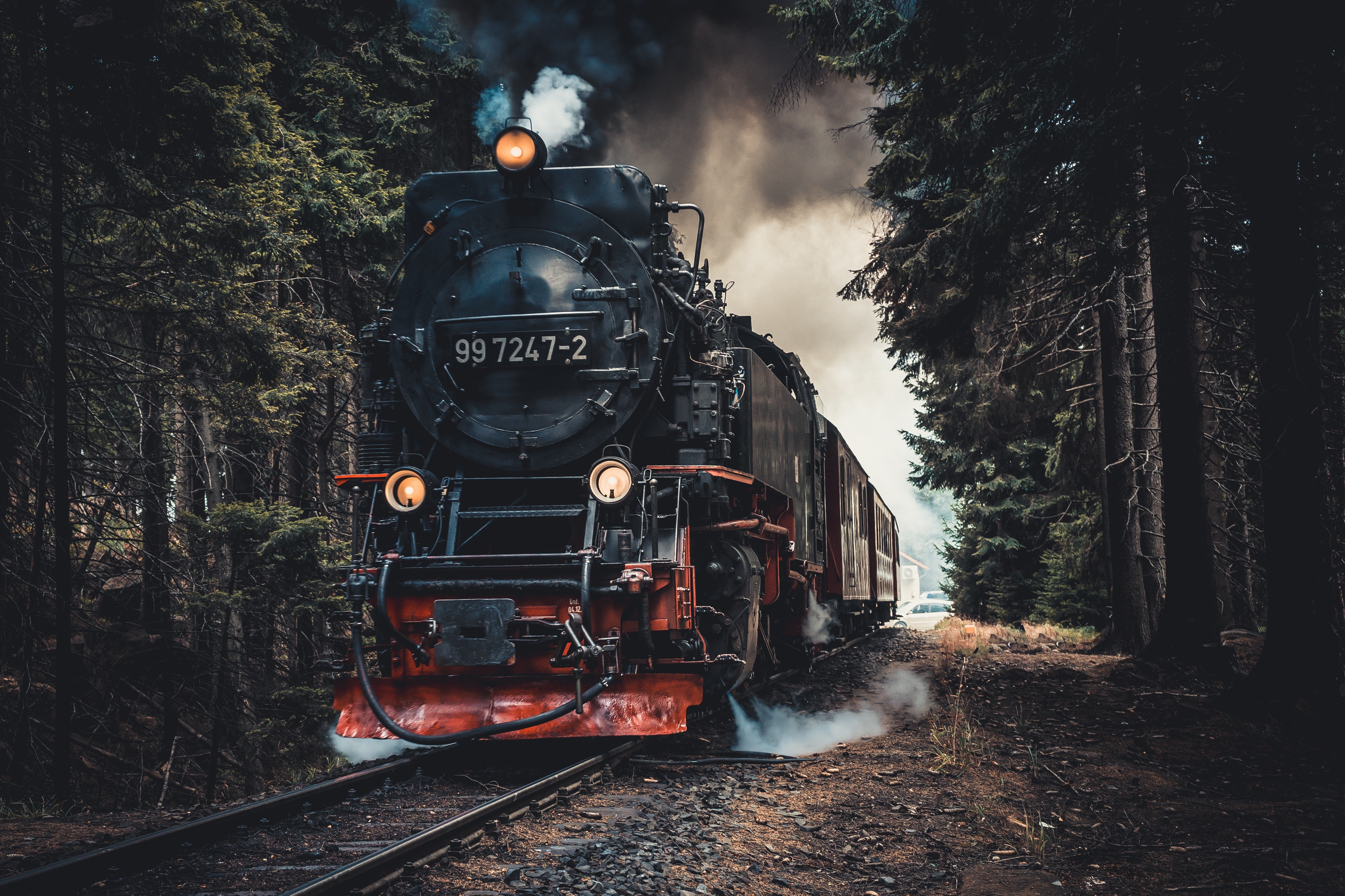 Pictured - A red and black train steam locomotive on a railway | Source: Pexels 