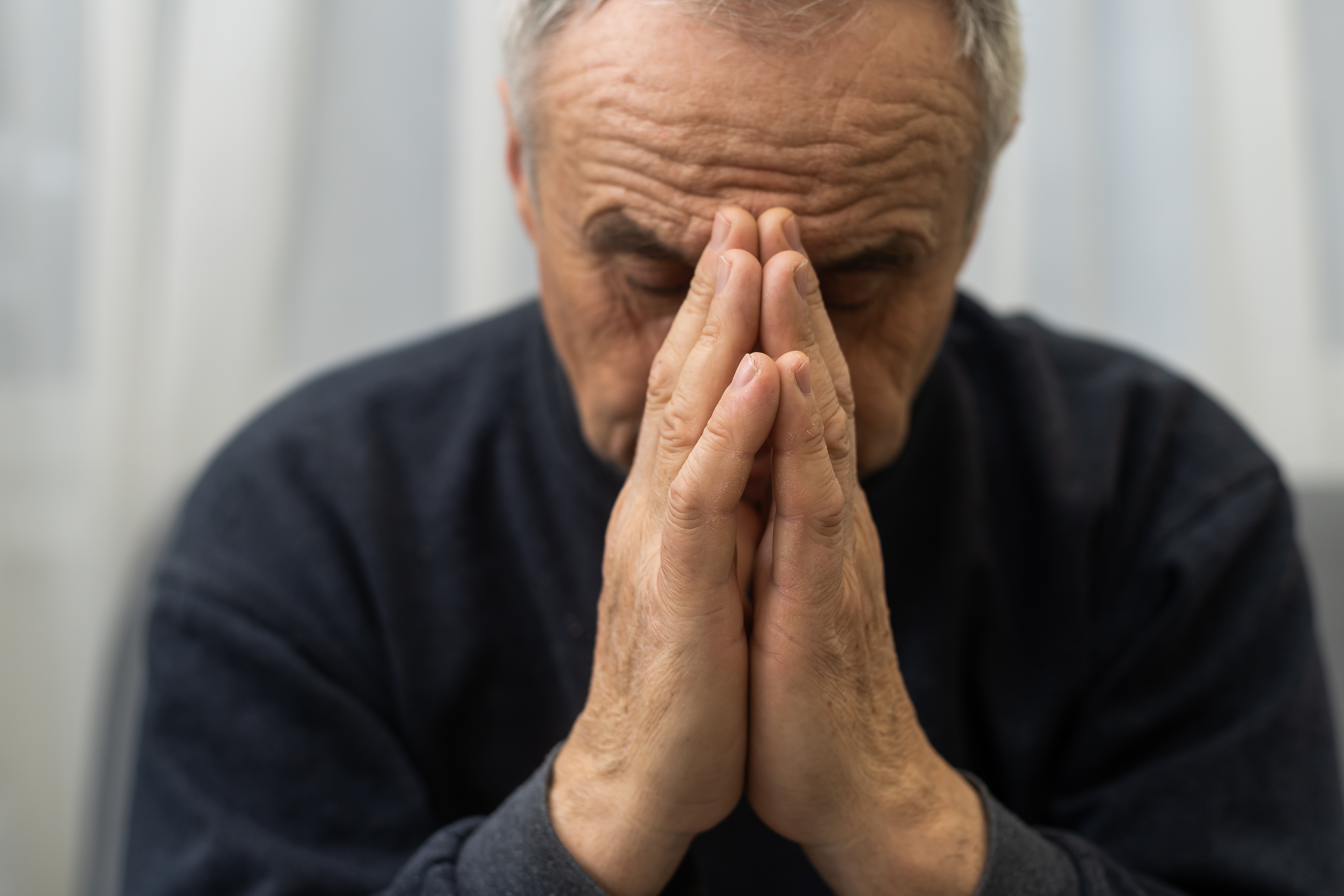 Man asks for forgiveness | Shutterstock