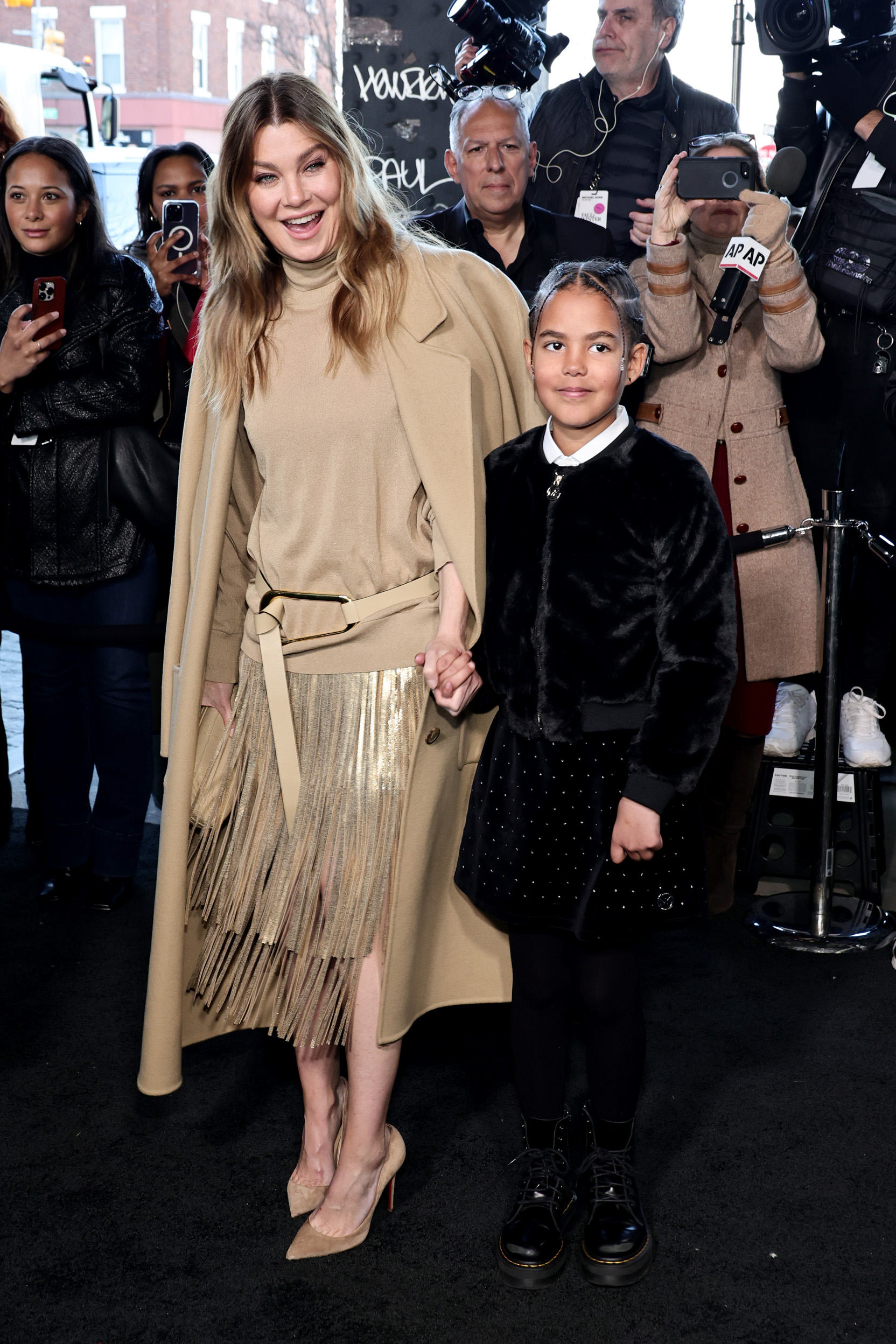 Ellen Pompeo and Sienna attend the Michael Kors Collection Fall/Winter Runway Show on February 15, 2023 in New York City | Source: Getty Images