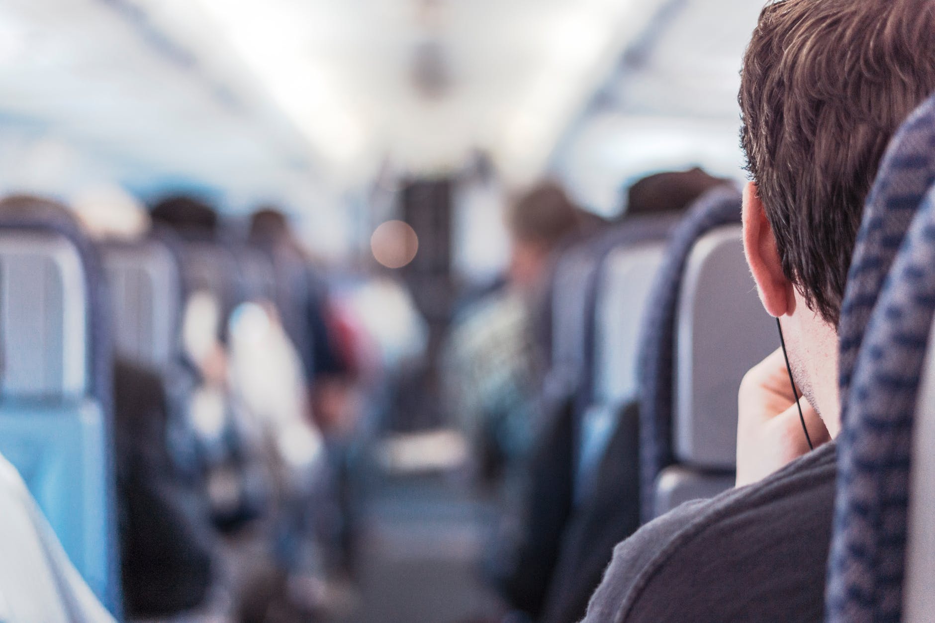 People on board an airplane. | Photo: Pexels