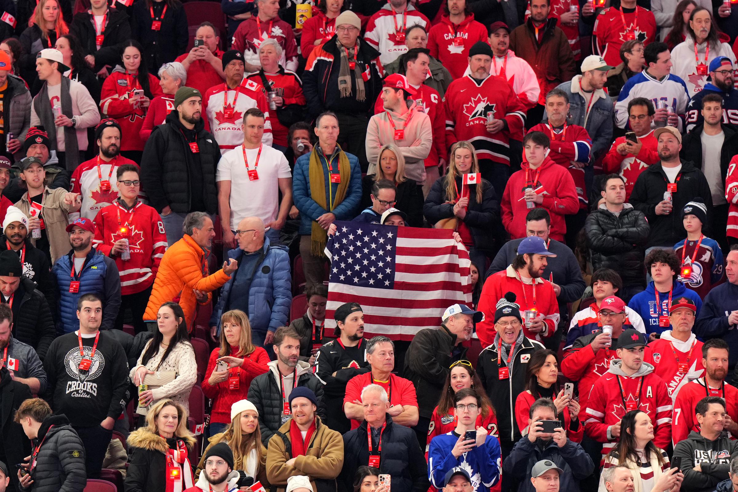 Team United States fans hold up an American flag during warm-up before the 4 Nations Face-Off game between the United States and Canada at Bell Centre on February 15, 2025 | Source: Getty Images