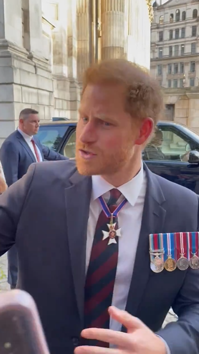 Prince Harry questions a fan for having two cameras pointed at him in a video dated May 9, 2024. | Source: X.com/AlexSeale