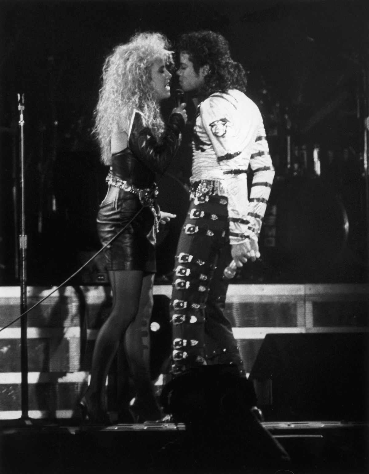 Pop star Michael Jackson performs a duet with backing singer Sheryl Crow during a concert in Rome, May 1988. | Getty Images