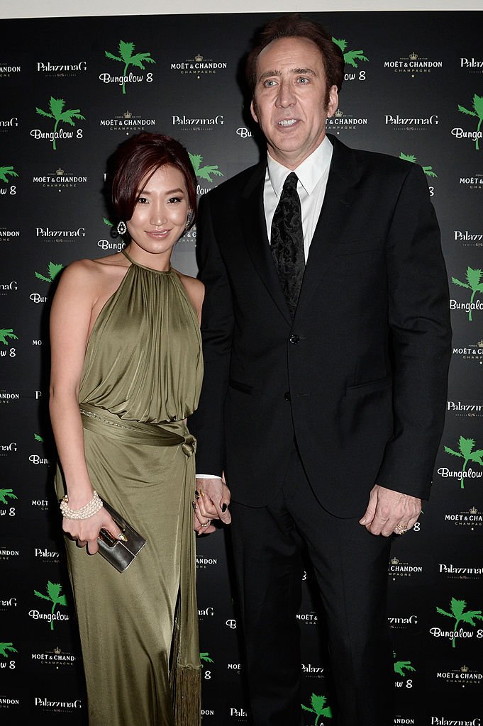 Alice Kim and actor Nicolas Cage at 'Bungalow 8 Pop Up at theVenice Film Festival' during the 70th Venice International Film Festival at Palazzina G on August 30, 2013 in Venice, Italy. | Source: Getty Images