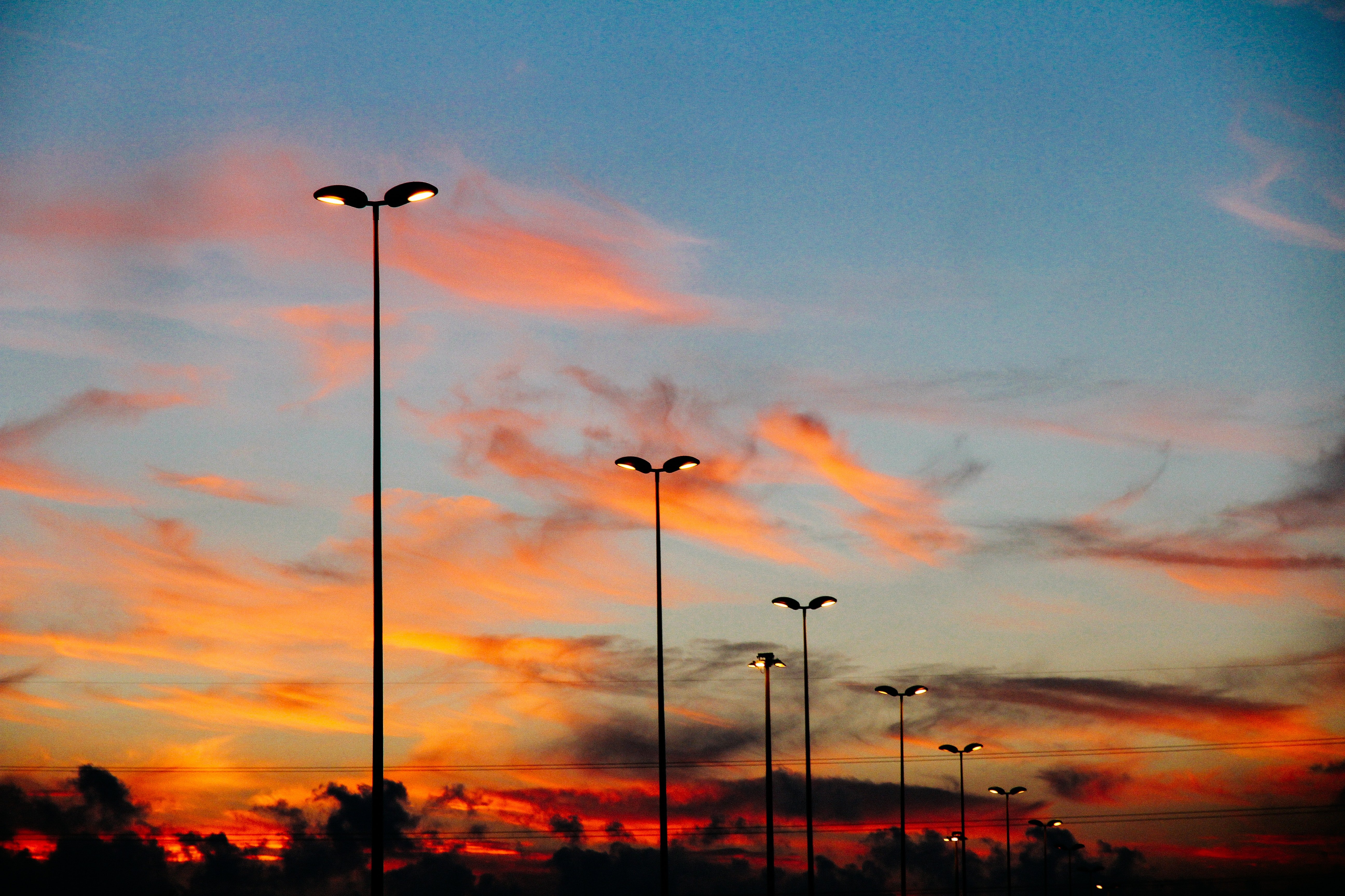 Street lamps in the sunset | Source: Pexels