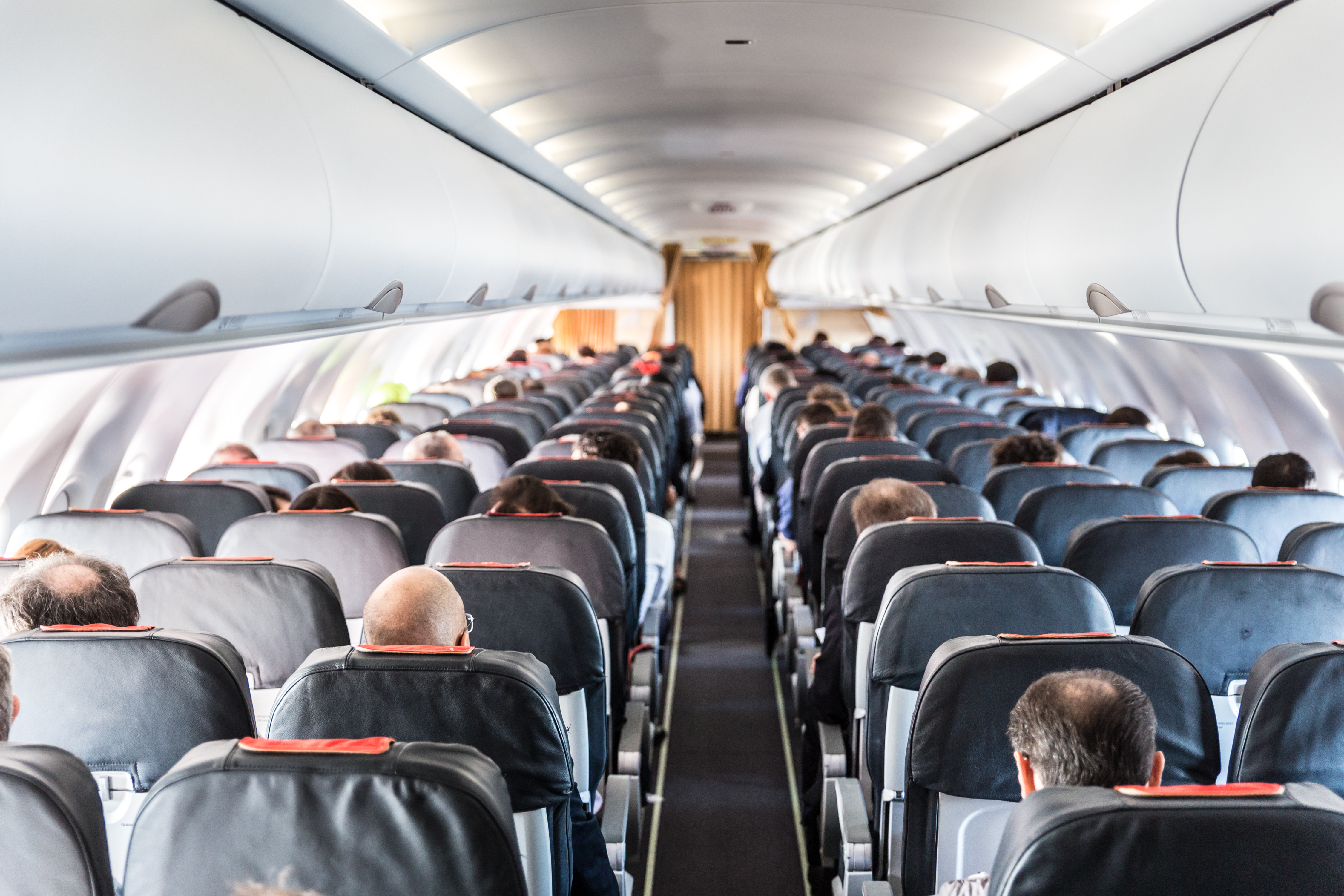 Passengers inside an airplane | Source: Shutterstock