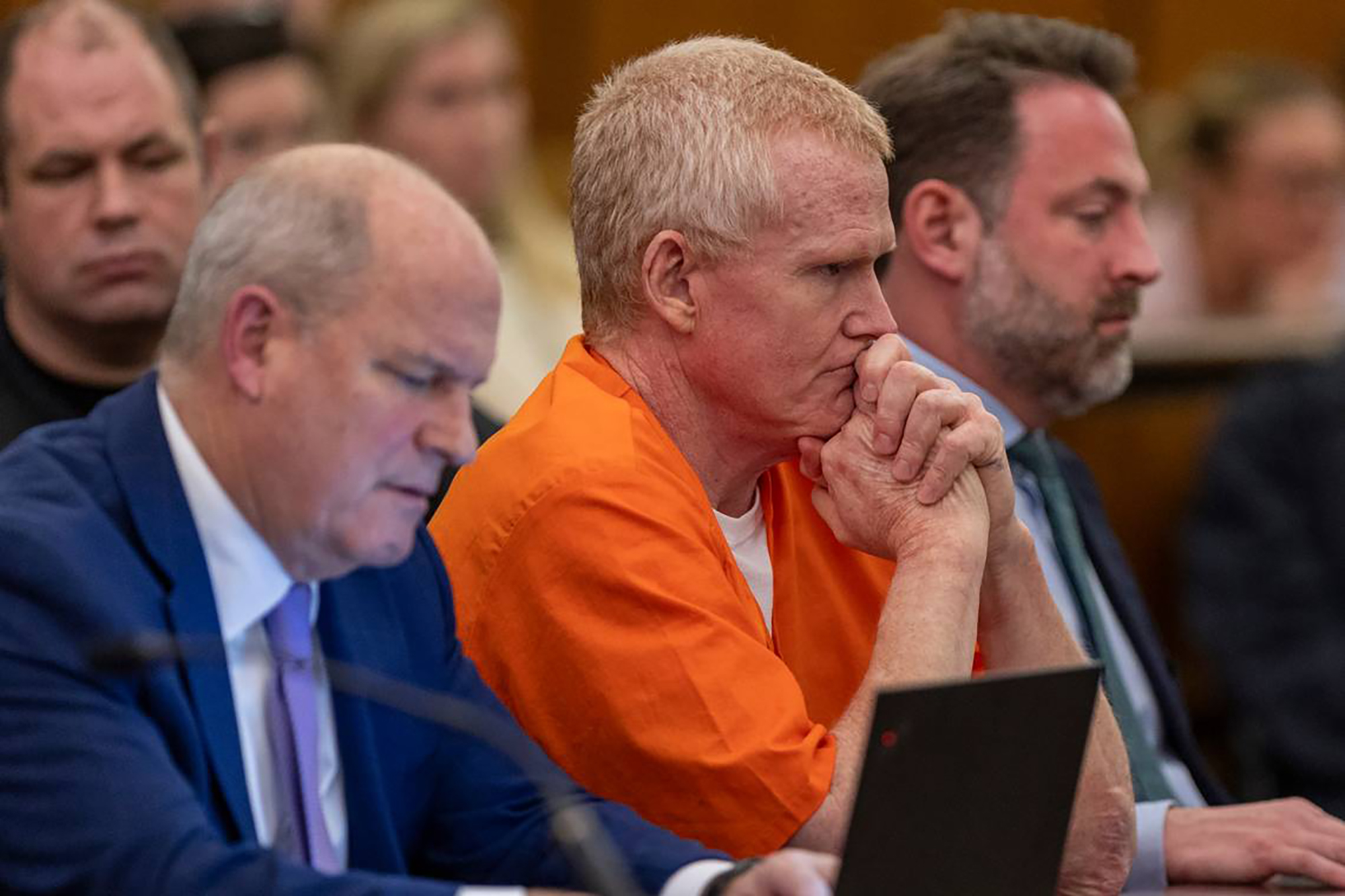 Alex Murdaugh clasps his hands and looks on as Judge Jean Toal delivers her verdict after a judicial hearing in Columbia, South Carolina on January 29, 2024. | Source: Getty Images