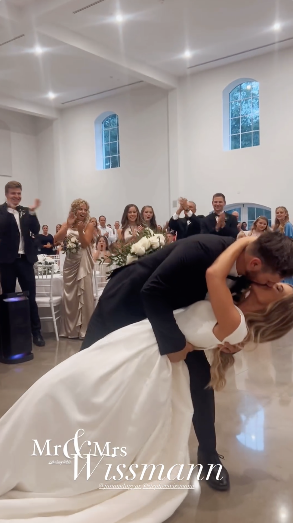 Stephen Wissmann kisses Jana Duggar at their reception venue, as shared in an Instagram Story in August 2024 | Source: Instagram/alaythia.wissmann