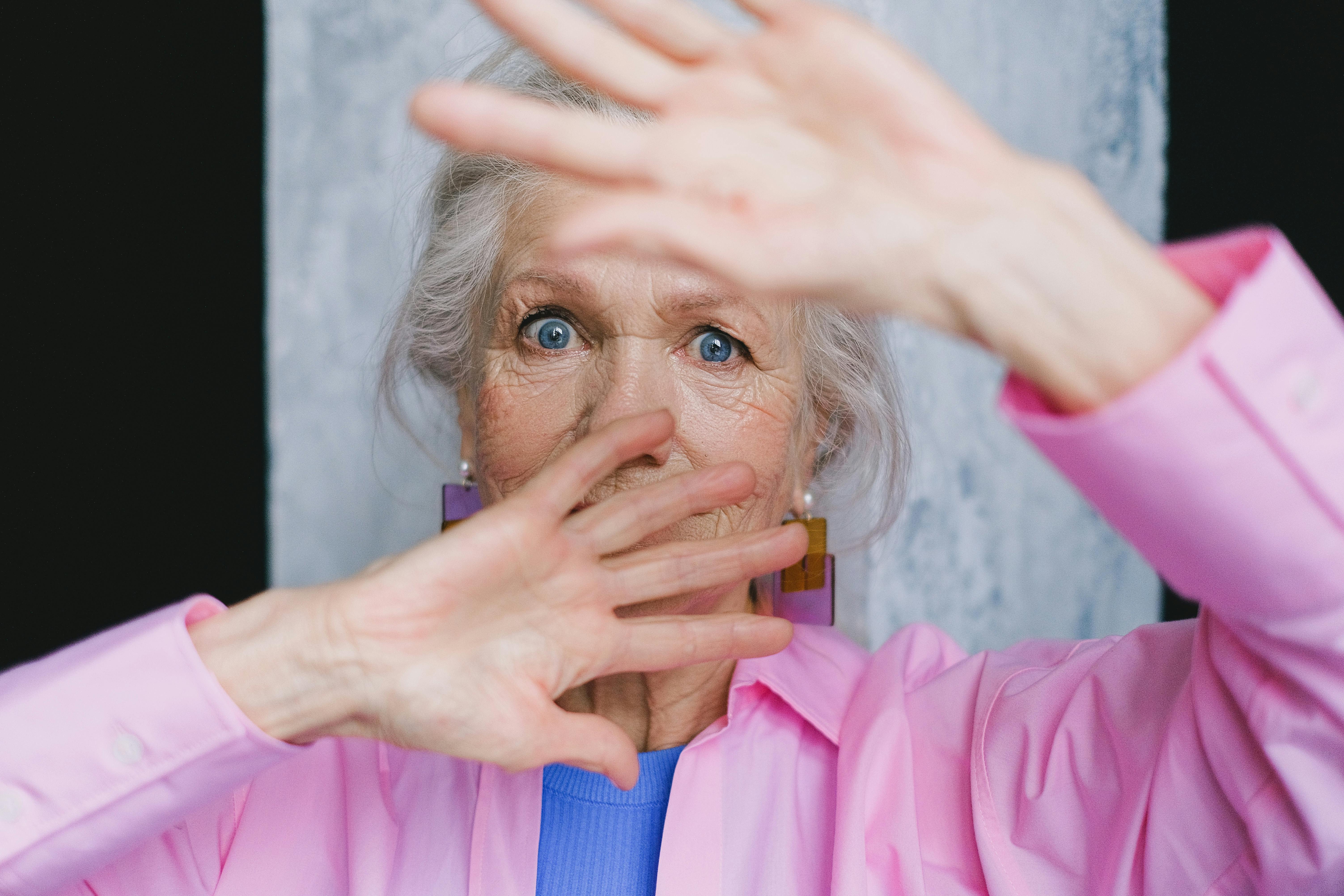 A woman covering her face | Source: Pexels