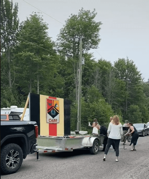 Individuals taking down the Central Algoma Secondary School's (CASS) portable graduation stage in Ontario, Canada.│ Source: TikTok/@leashorlando