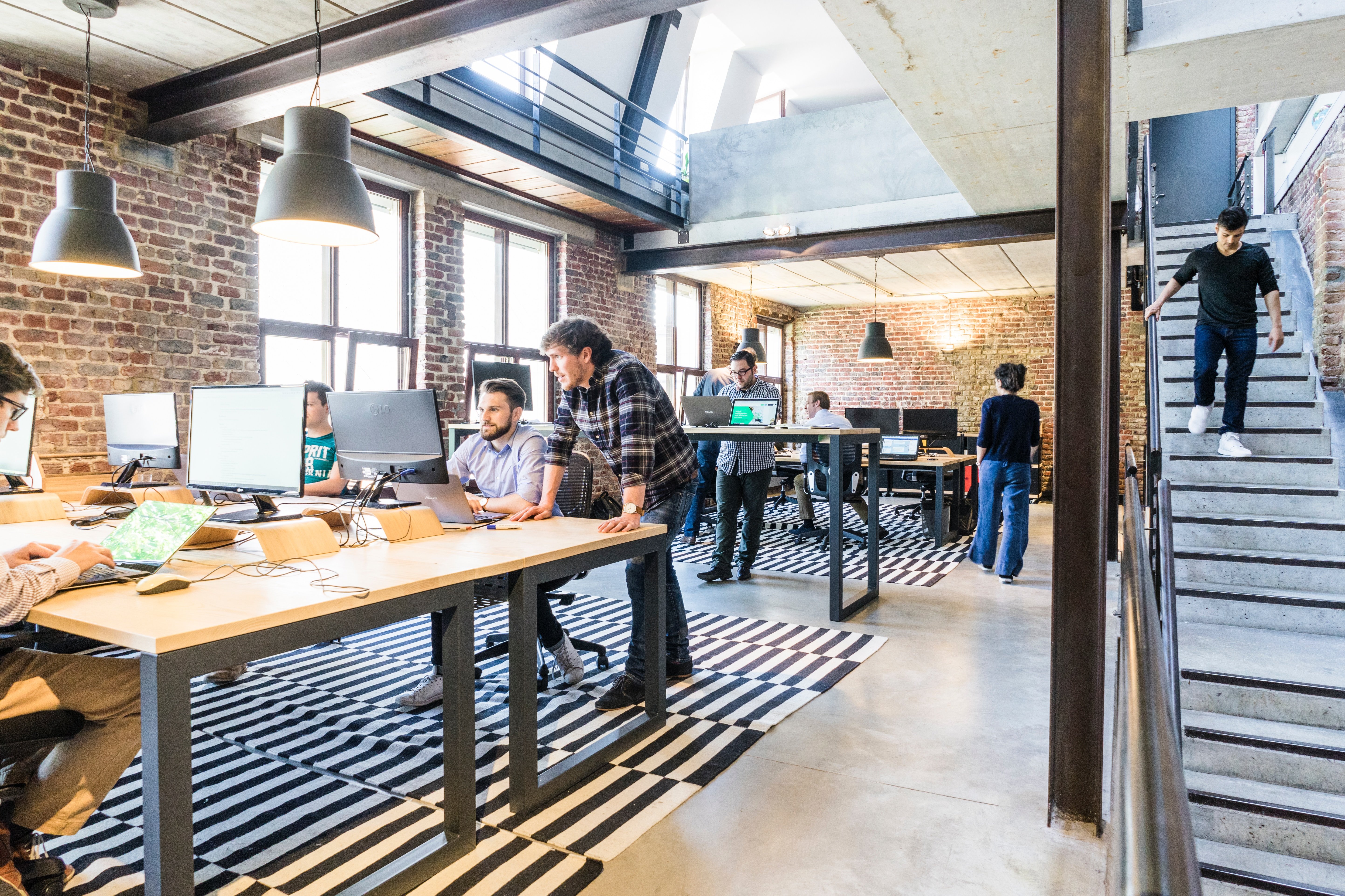 Two office personnel talking | Source: Unsplash.com Two office personnel talking | Source: Unsplash.com