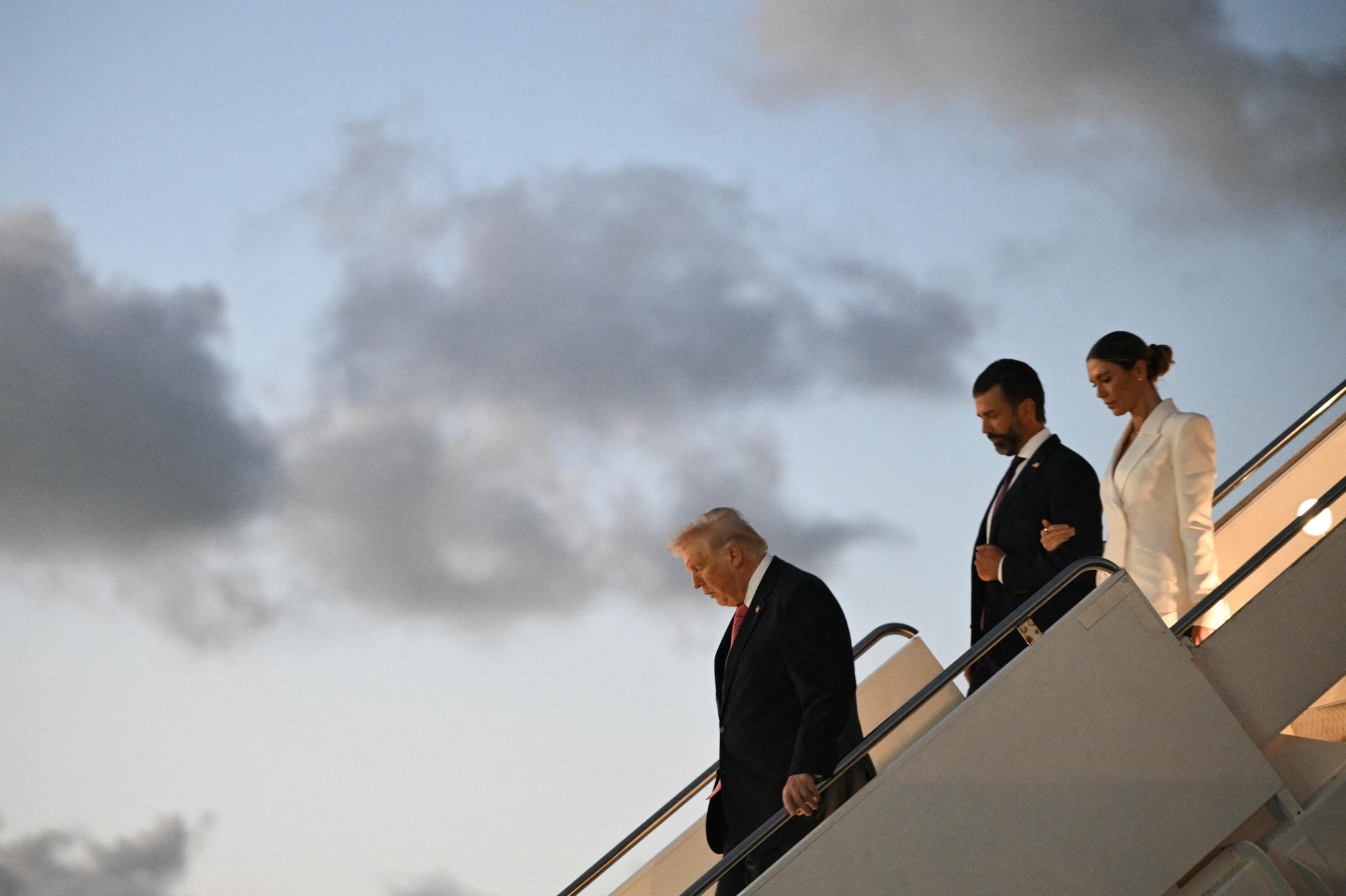 President Donald Trump, Donald Trump Jr. and Bettina Anderson arrive in West Palm Beach, Florida, aboard Air Force One on March 27, 2026 | Source: Getty Images