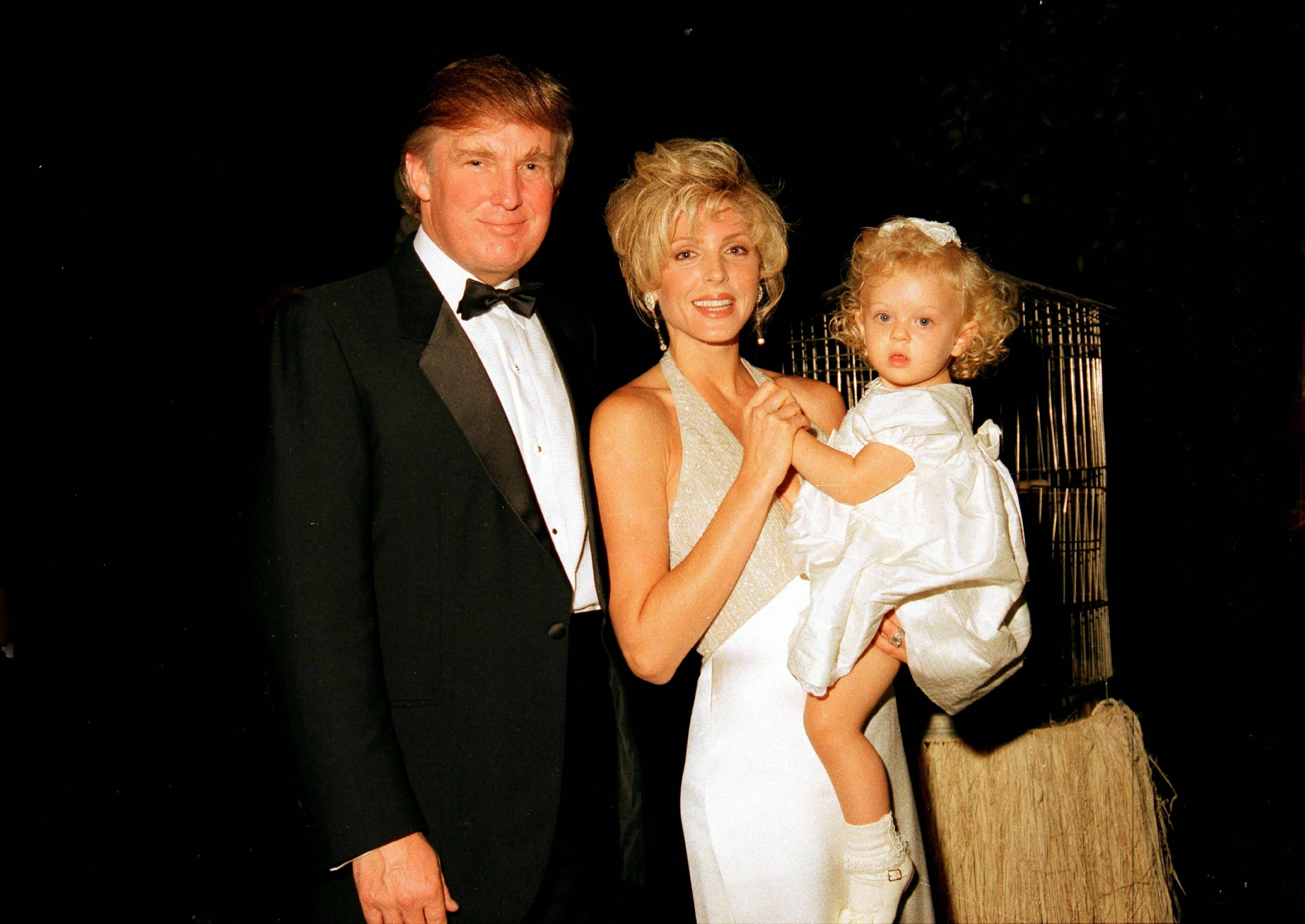 Donald Trump and Marla Maples, and their daughter, Tiffany, during the official opening party of the Mar-a-Lago Club, Palm Beach, Florida, April 22, 1995. | Source: Getty Images