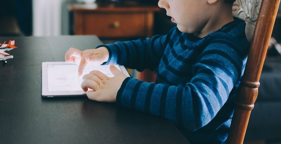 A child playing a gadget. | Photo: pixabay.com