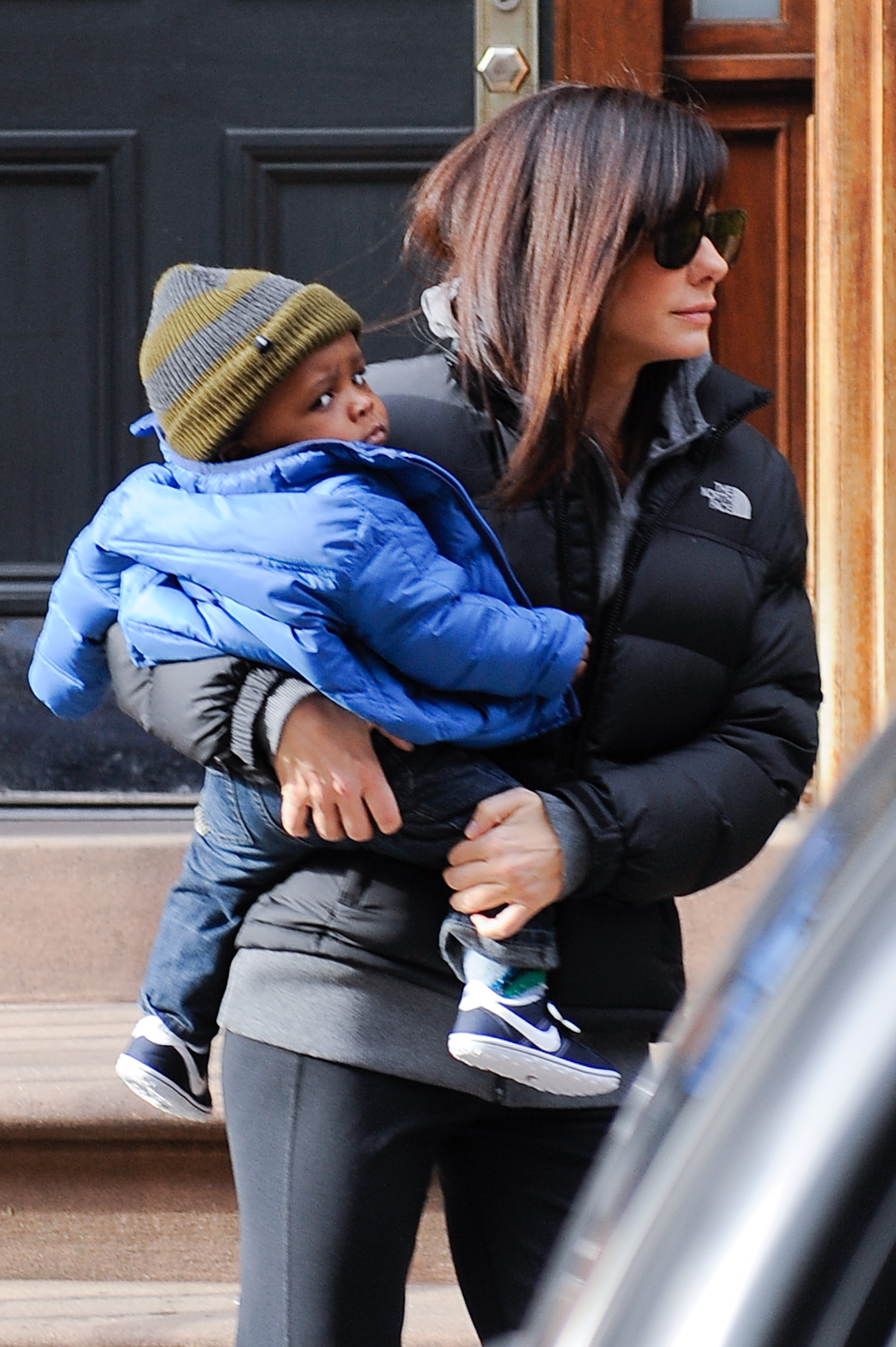 Sandra Bullock is seen carrying her son, Louis Bardo Bullock, on January 20, 2011, in New York City | Source: Getty Images