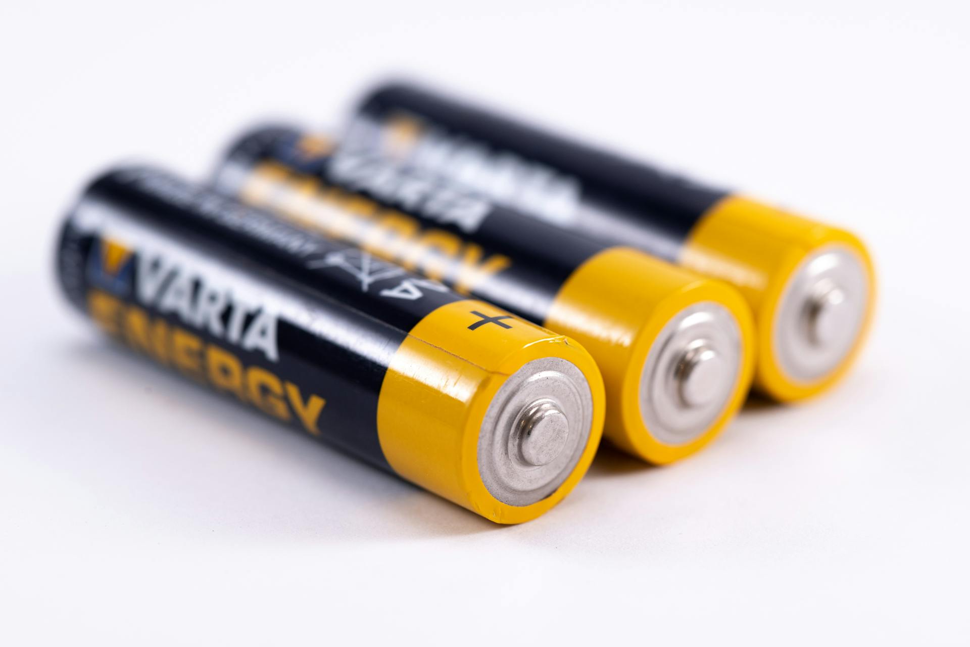 A closeup shot of black and yellow-colored batteries | Source: Pexels