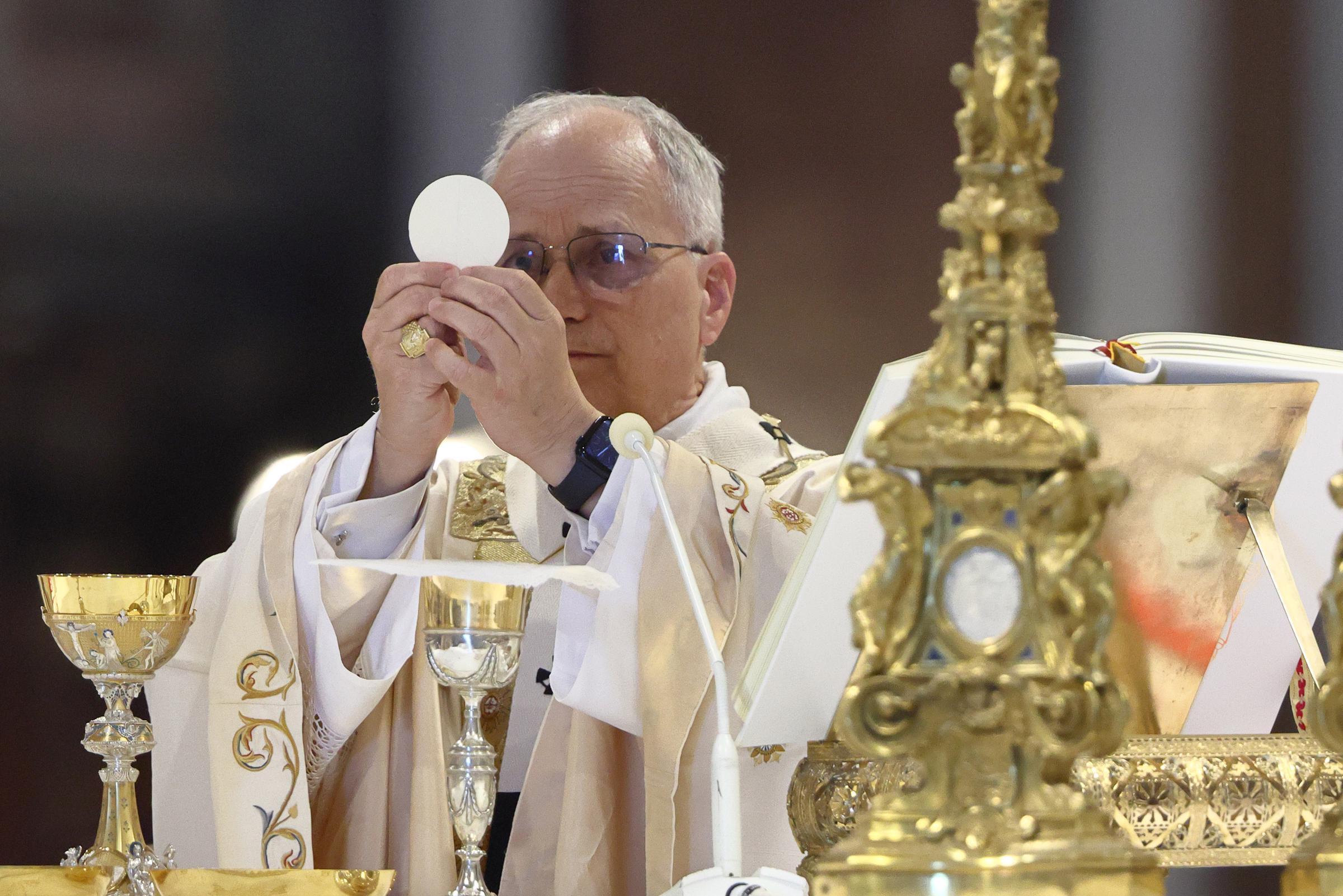 Pope Leo XIV elevates the Eucharist during his first Mass at the Basilica of St. John Lateran in Rome on May 25, 2025 | Source: Getty Images