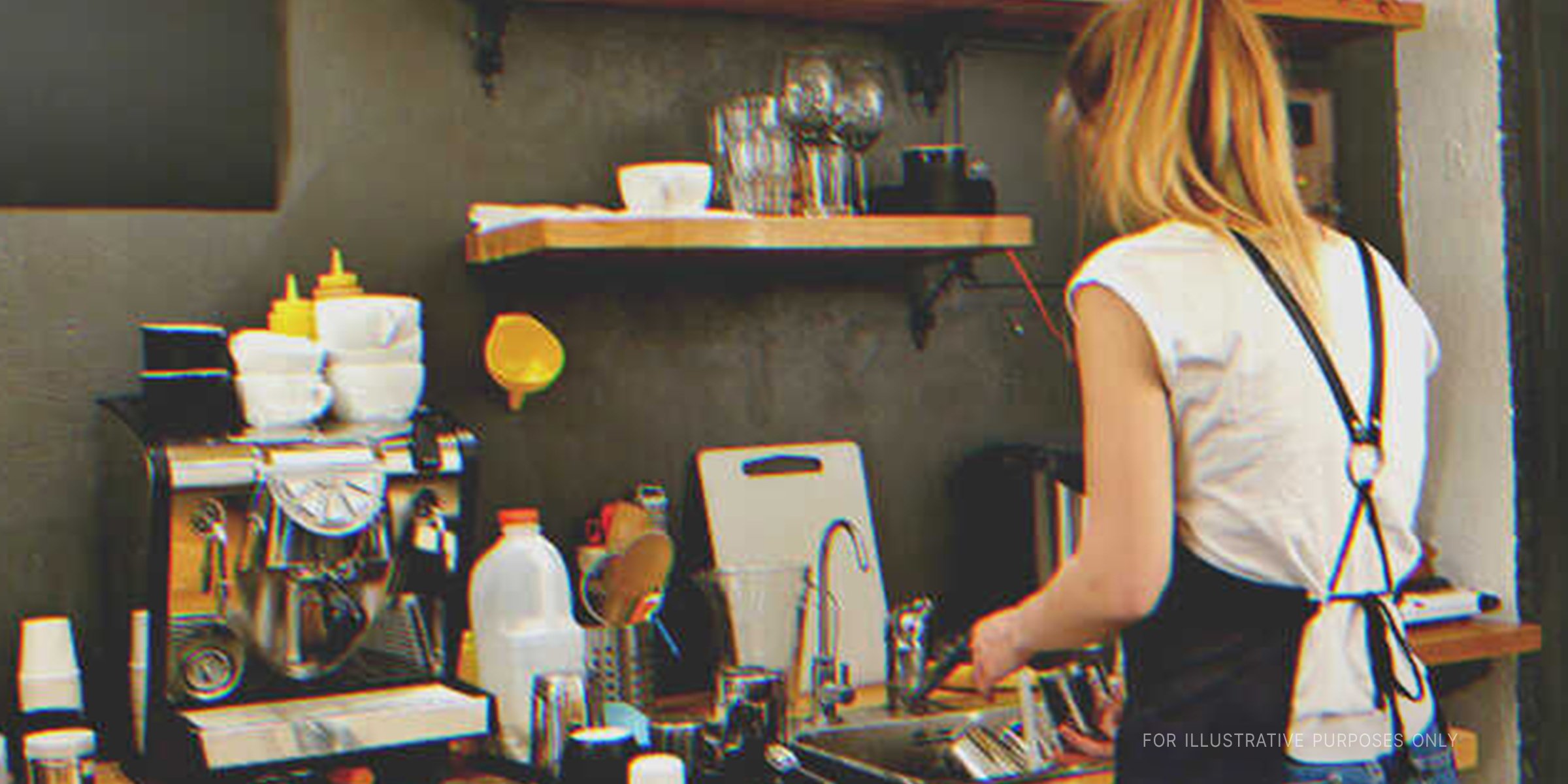 Young woman washing dishes | Source: Shutterstock