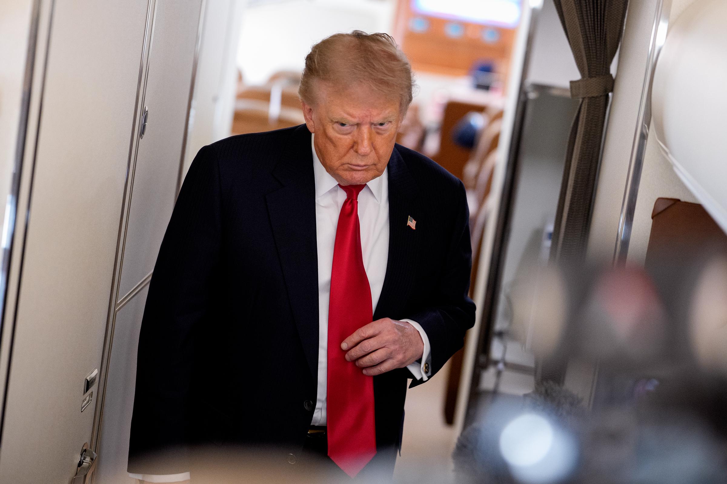 Donald Trump boarded Air Force One on July 27, 2026, a day before attending Lindsey Graham's funeral at the Washington National Cathedral. The solemn appearance shown during the service later became the focus of widespread online debate, with viewers closely analyzing moments that unfolded after this trip to Washington. | Source: Getty Images