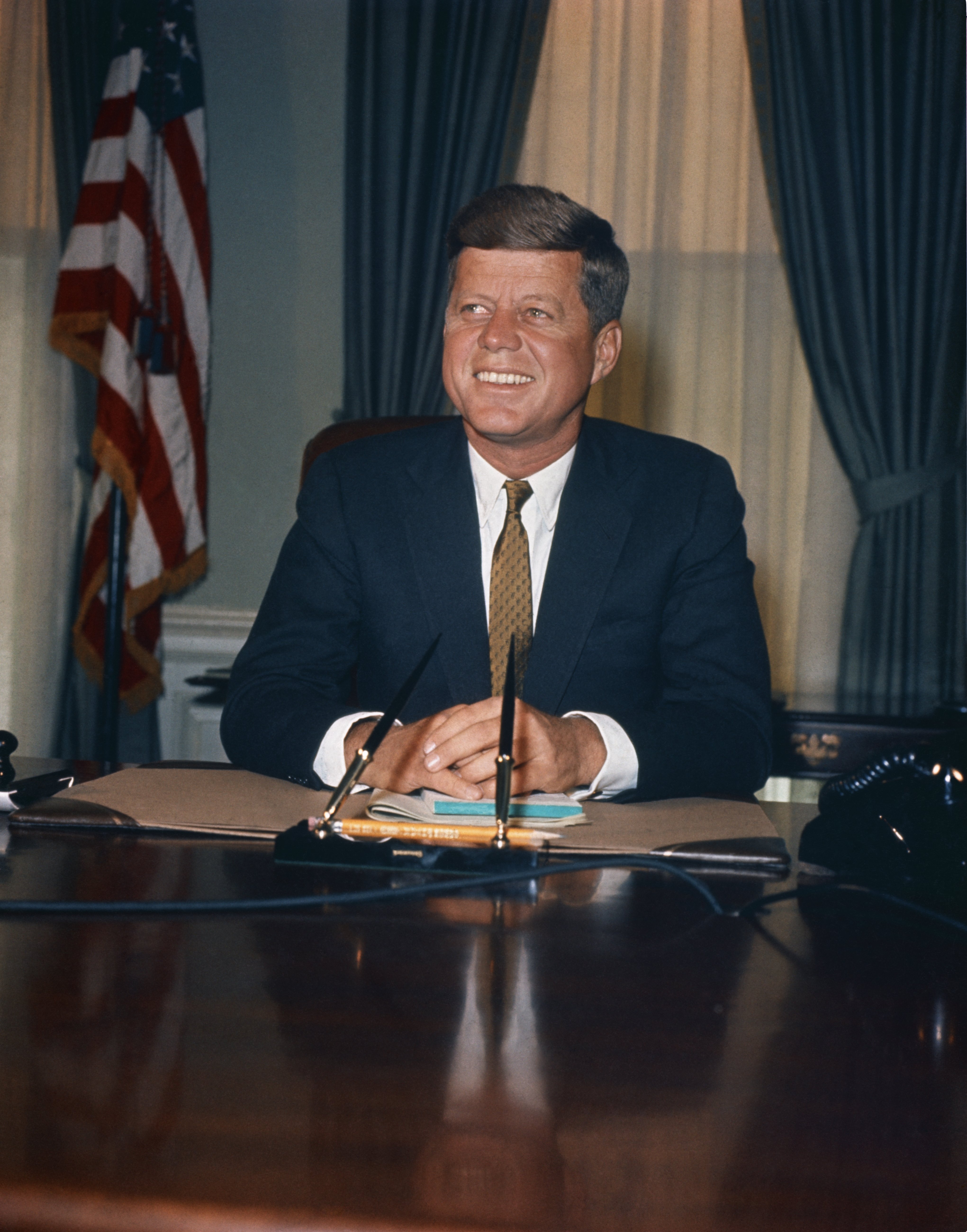 John F. Kennedy pictured at his desk in Oval Office in The White House. | Photo: Getty Images