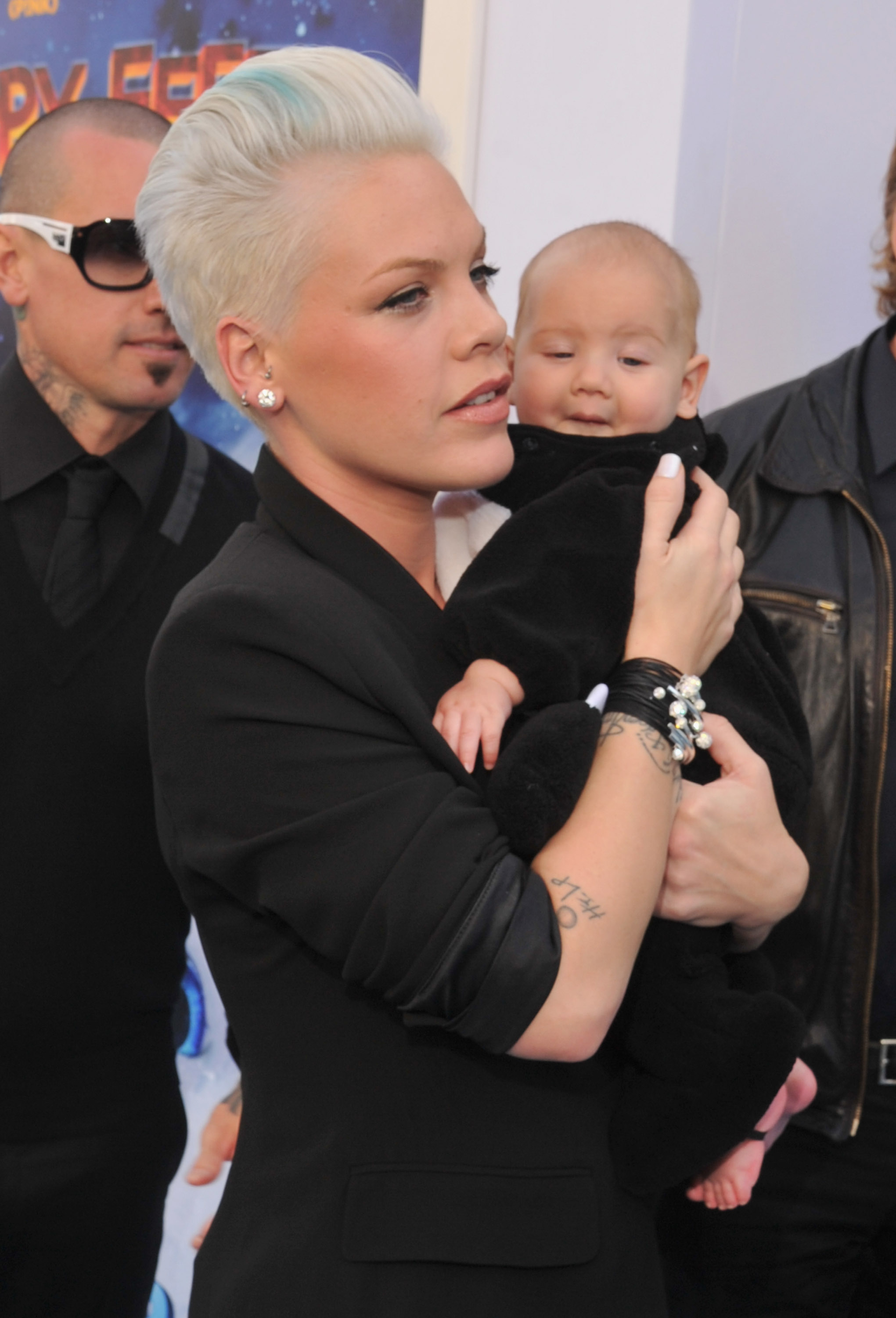 At the "Happy Feet Two" premiere on November 13, 2011, in California, United States, baby Willow Sage Hart made one of her earliest red-carpet appearances, nestled securely in her mother's arms as cameras flashed around them. Wrapped in black and gazing curiously at the crowd, she effortlessly became the evening's quiet centre of attention.