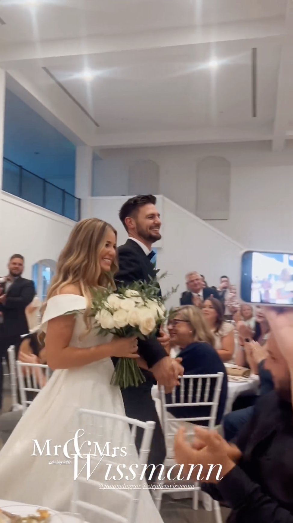 The wedding guests look at Jana Duggar and Stephen Wissmann as they enter the reception venue, as shared in an Instagram Story in August 2024 | Source: Instagram/alaythia.wissmann