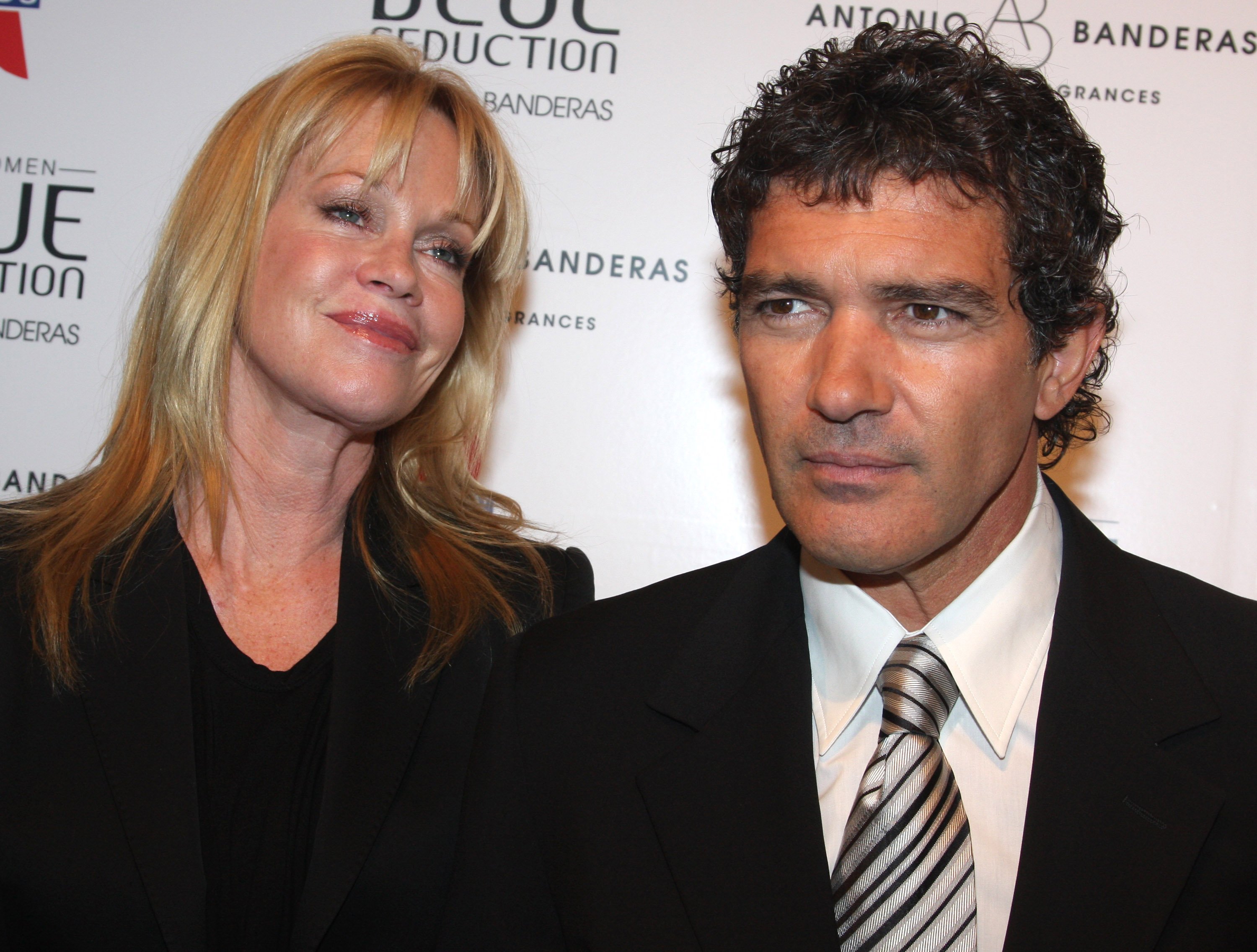 Actor Antonio Banderas and actress Melanie Griffith pose at The Antonio Banderas' Blue Seduction for Women fragrance launch at Cedar Lake on July 10, 2008 in New York City ┃Source: Getty Images