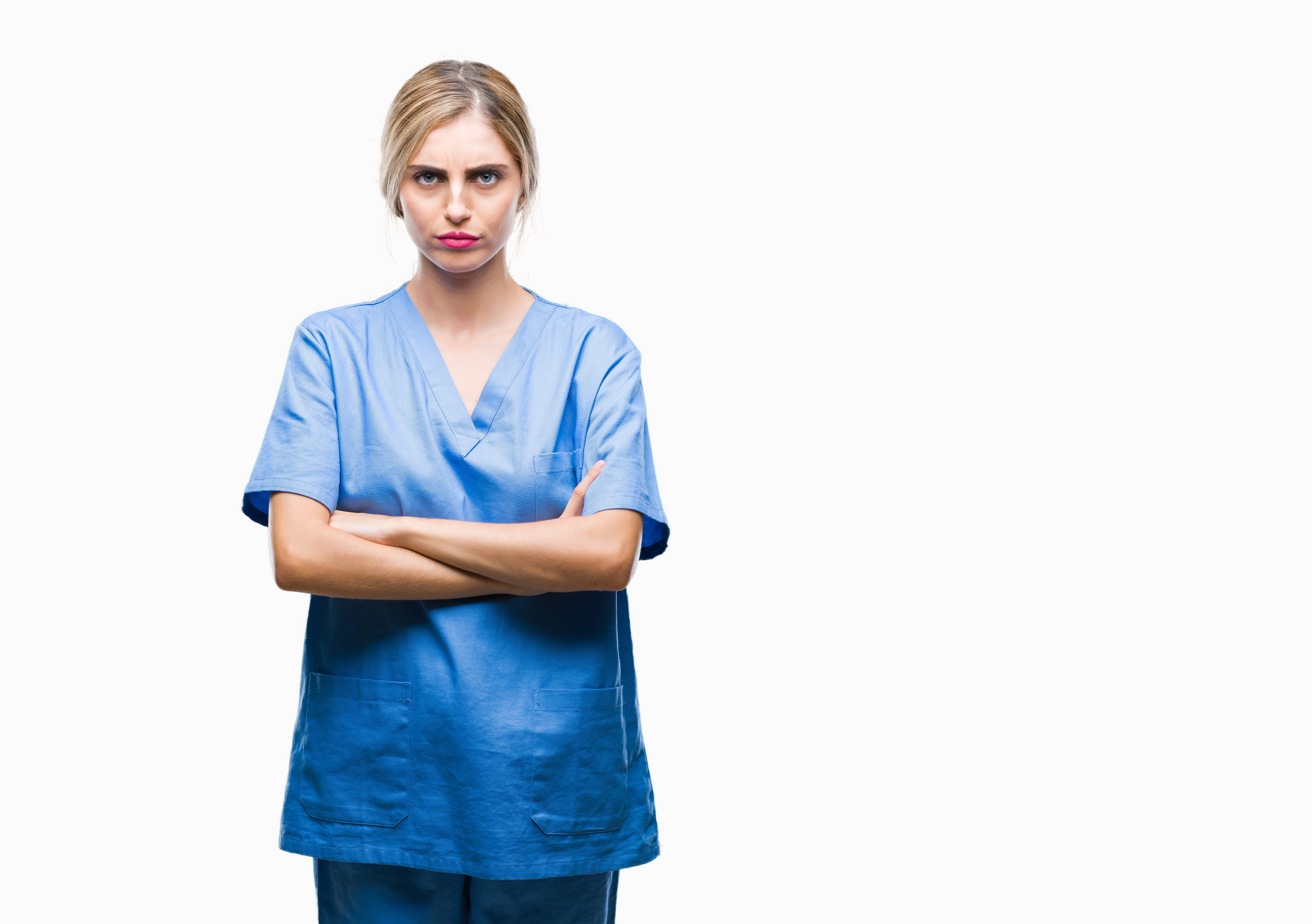 Woman in scrubs with arms crossed in anger | Source: Getty Images