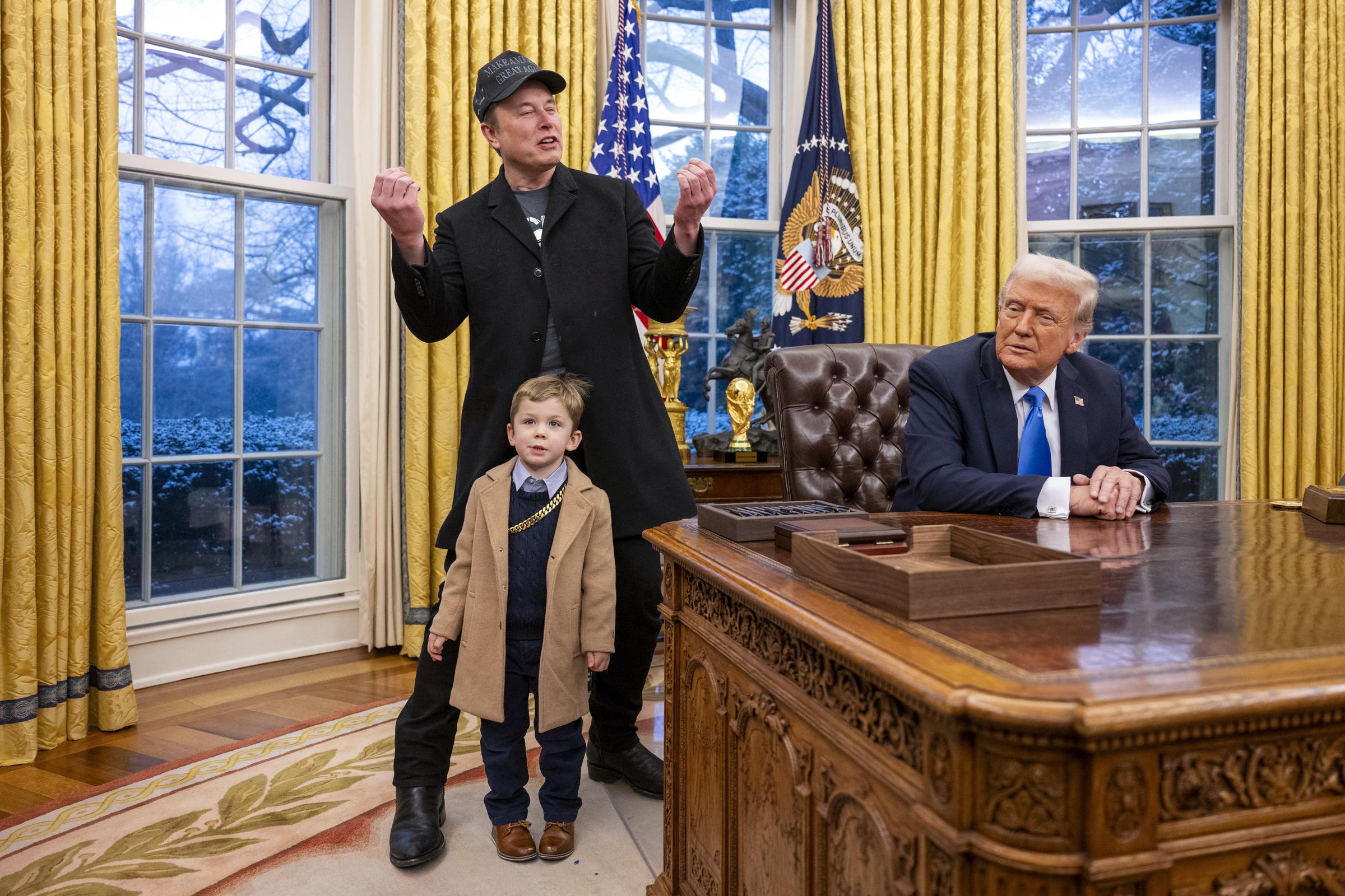 Elon Musk and X Æ A-Xii join Donald Trump as he signs executive orders in the Oval Office of the White House in Washington, D.C. on February 11, 2025 | Source: Getty Images