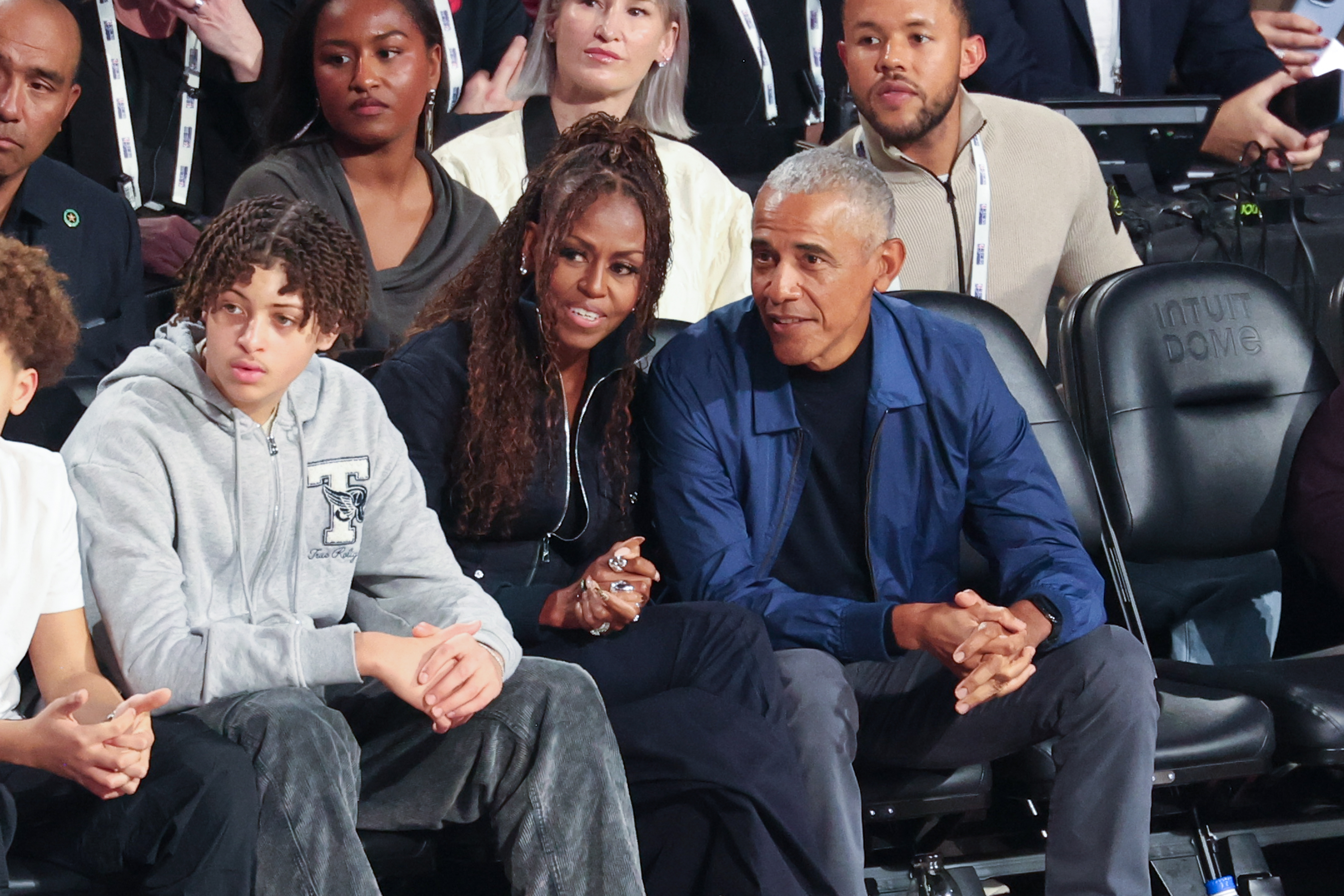 Michelle and Barack Obama watching the game at Intuit Dome. | Source: Getty Images