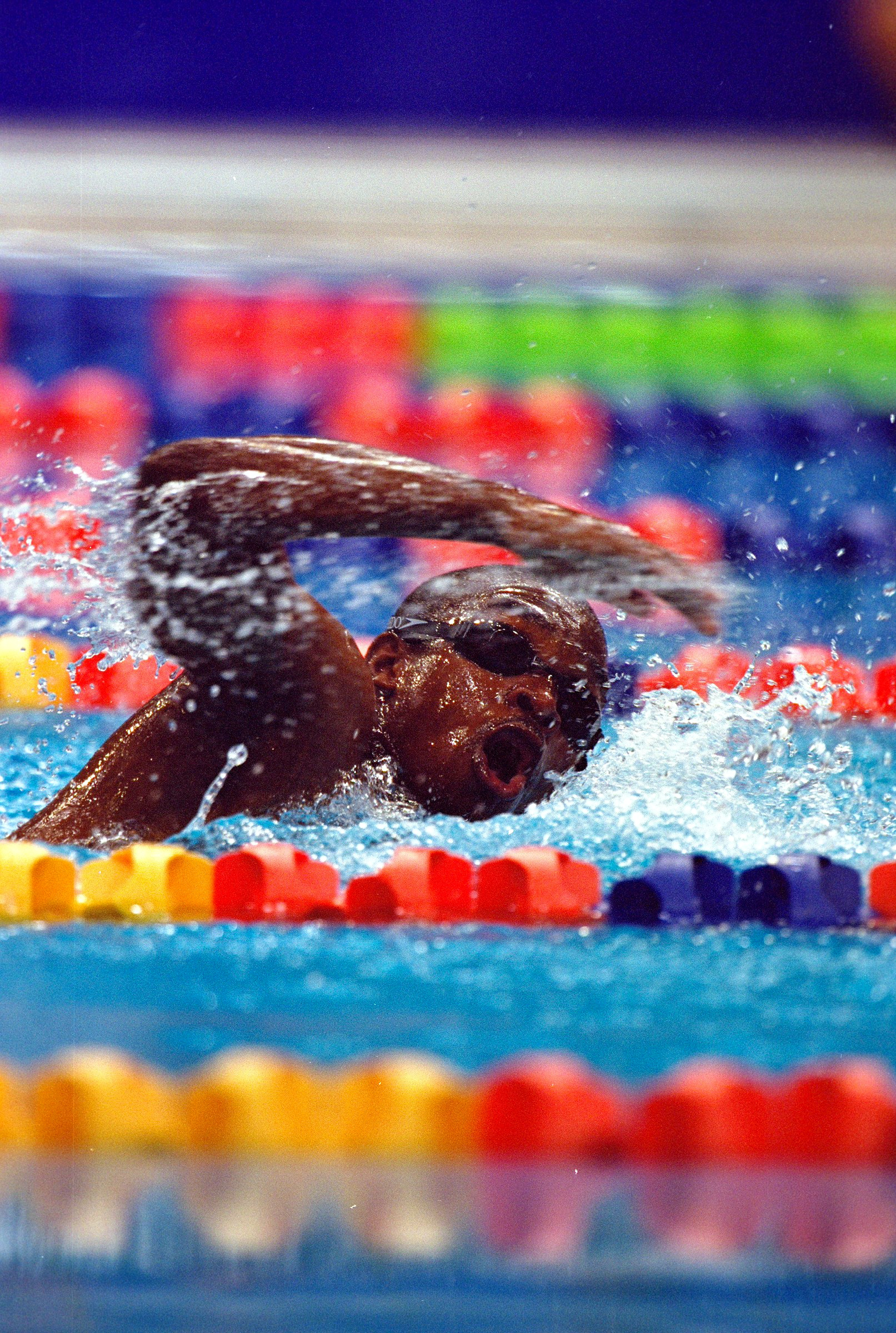 Eric Moussambani swims alone in the Men's 100m Freestyle Heat at the Sydney 2000 Olympic Games, on September 19, 2000, in Sydney, Australia | Source: Getty Images