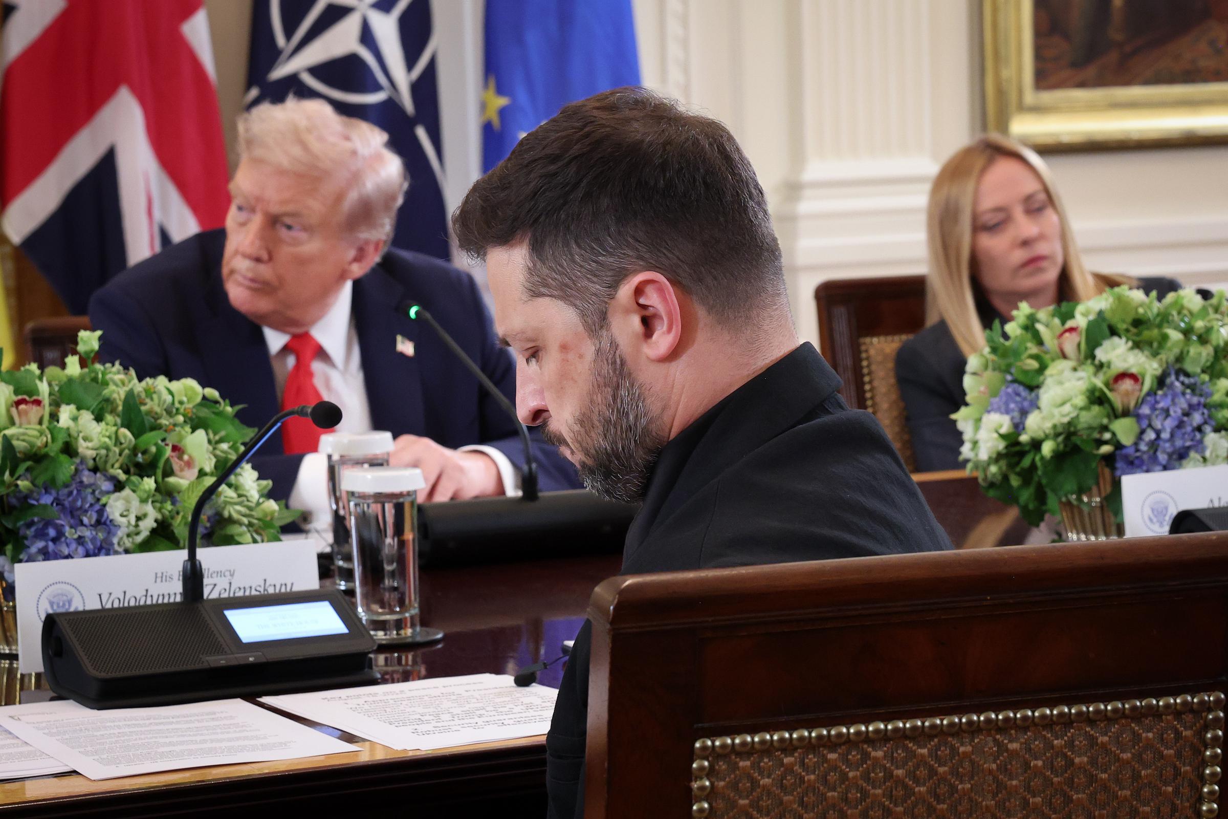 President Volodymyr Zelenskyy listens as President Donald Trump, Italian Prime Minister Giorgia Meloni (R) and other European leaders attend a meeting at the White House in Washington, DC on August 18, 2025 | Source: Getty Images