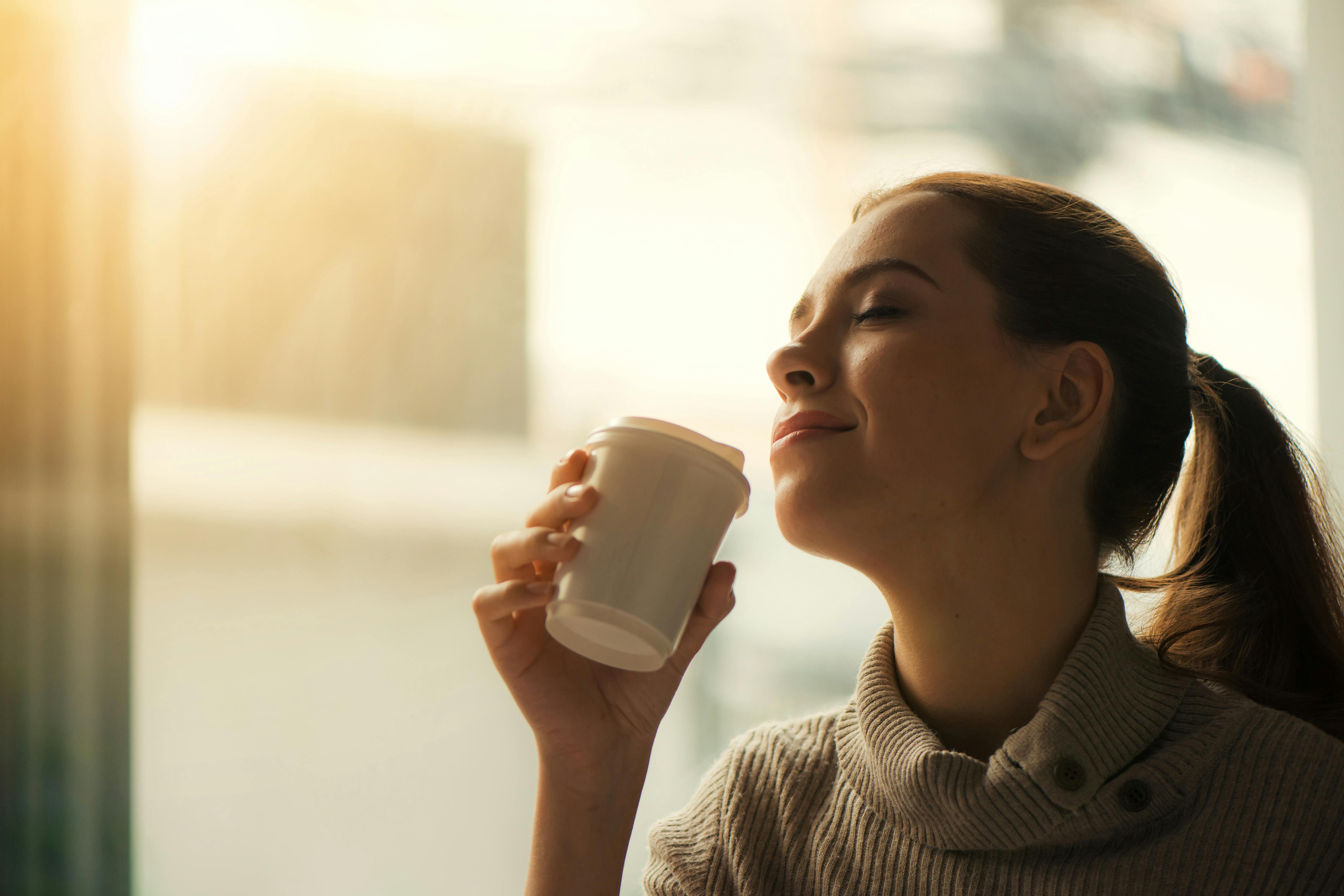 A woman drinking coffee | Source: Pexels